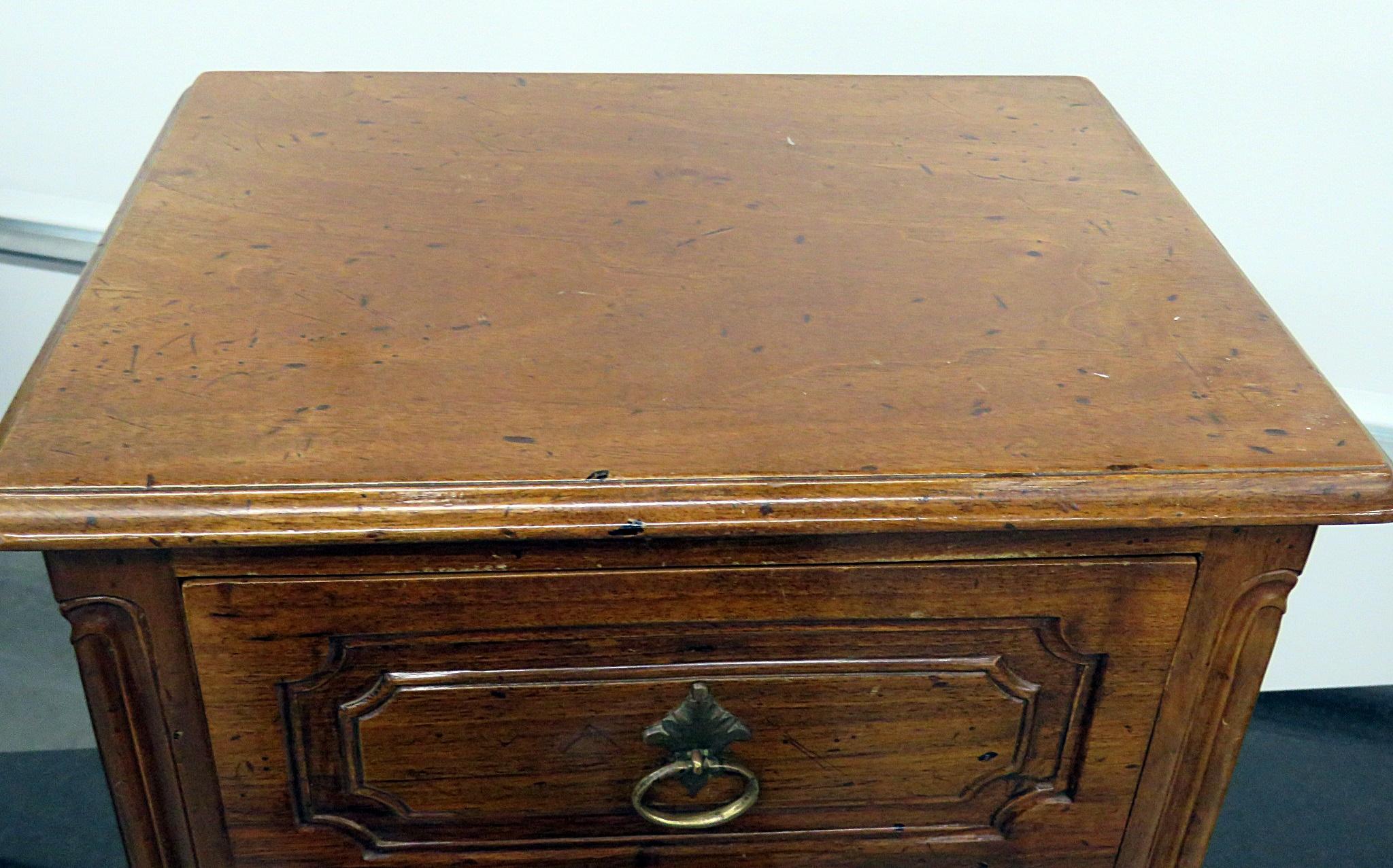Louis XVI style 2 drawer petite commode with a distressed finish.
