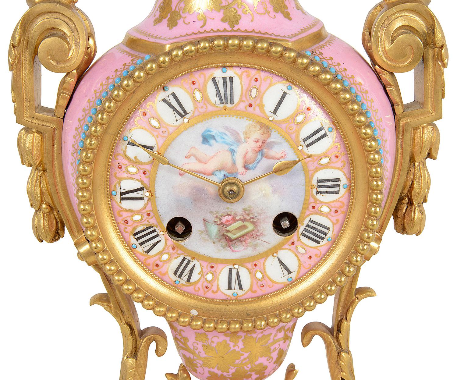 A very good quality French 19th Century Louis XVI style gilded ormolu and 'Severs' style pink porcelain mantel clock. In the form of a vase with an inset clock face, an eight day duration, striking on the hour and half hour. Gilded ormolu children's