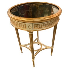 Louis XVI style round parcel gilt table with black marble top