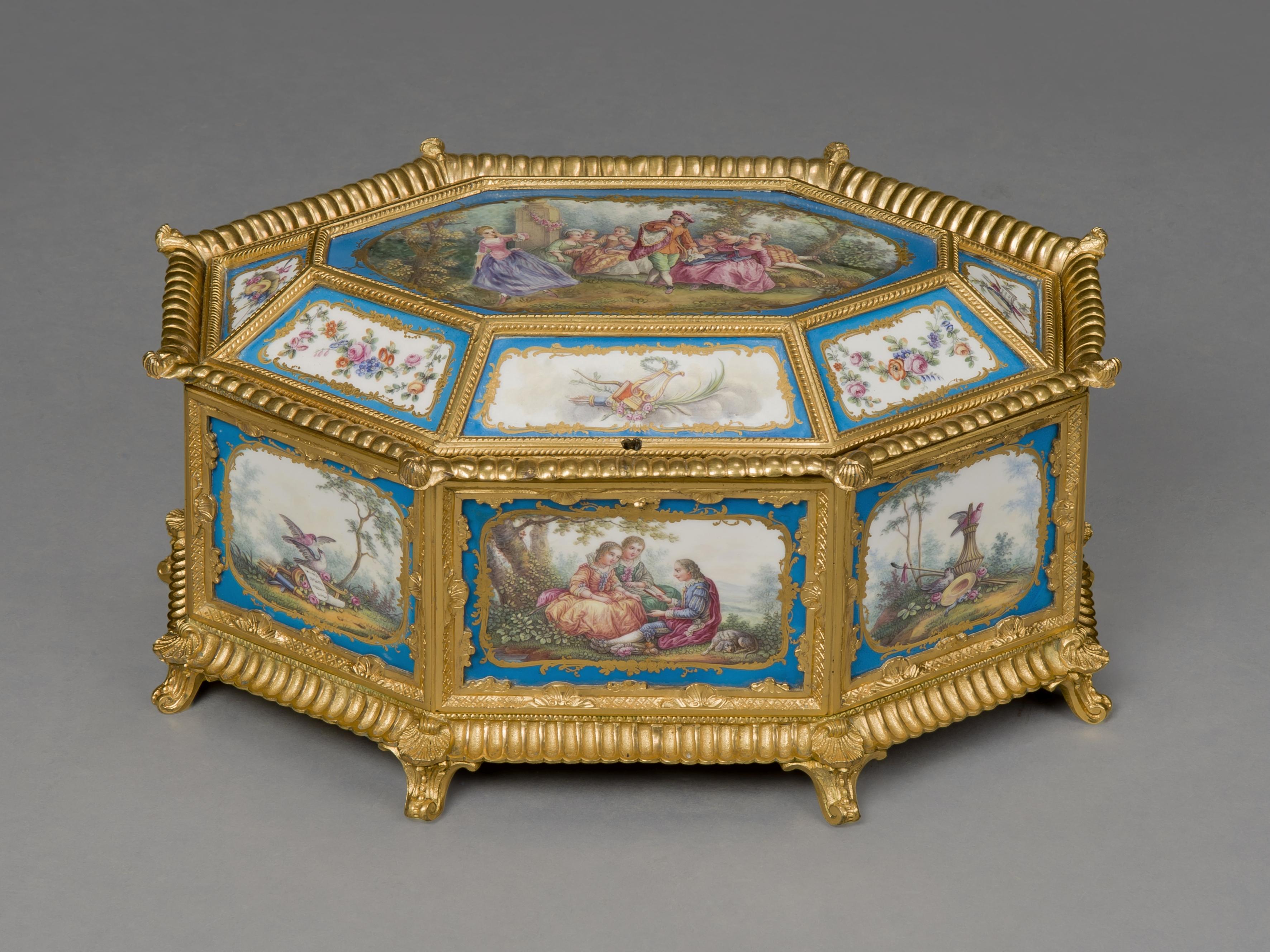 A fine Louis XVI style gilt bronze and Sèvres-style porcelain mounted octagonal table box.

French, circa 1890.

This fine porcelain and gilt bronze-mounted box has an octagonal hinged lid centering a Sèvres-style plaque depicting a scene from