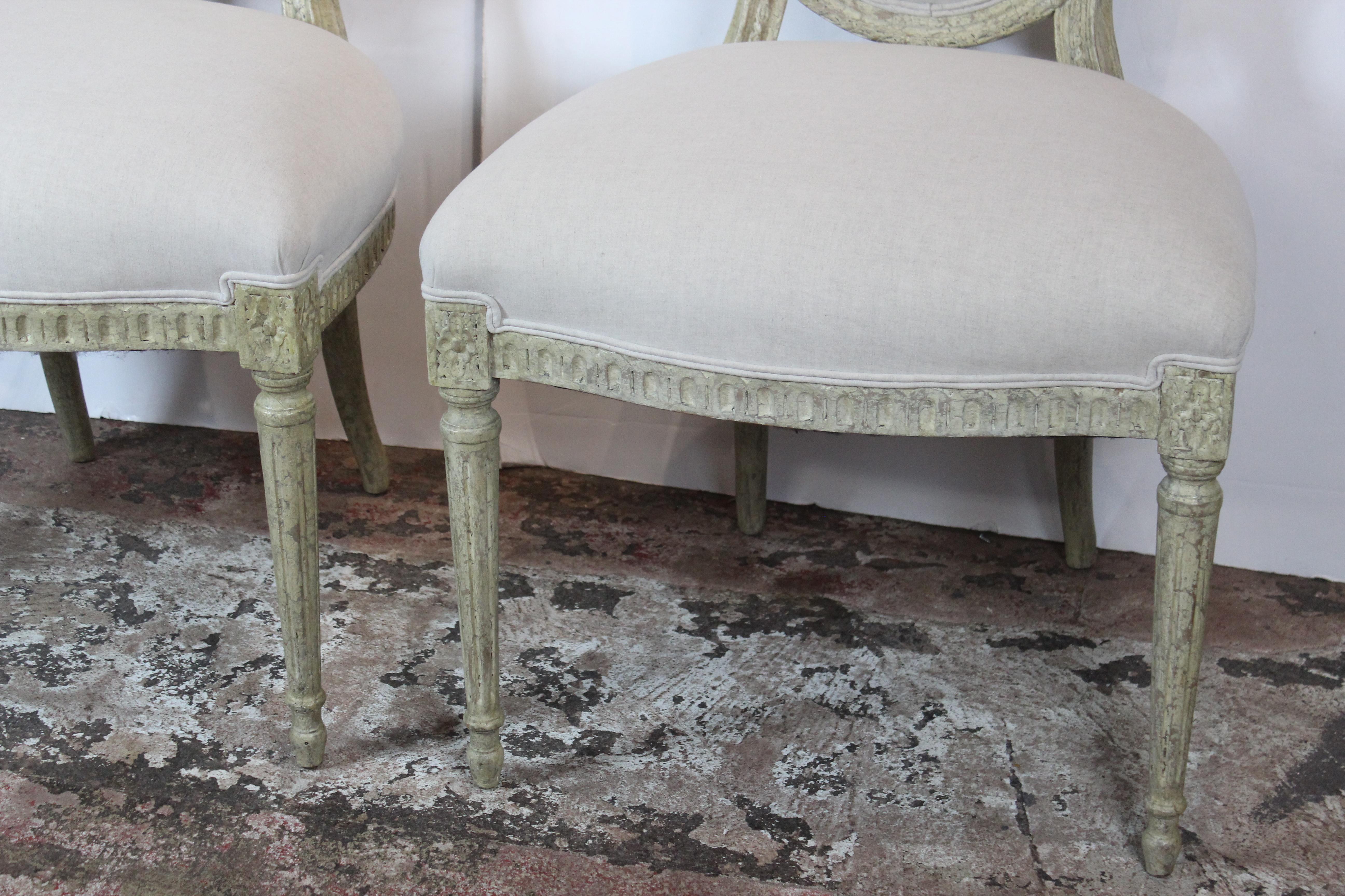 Louis XVI style side chairs. Upholstered in linen.