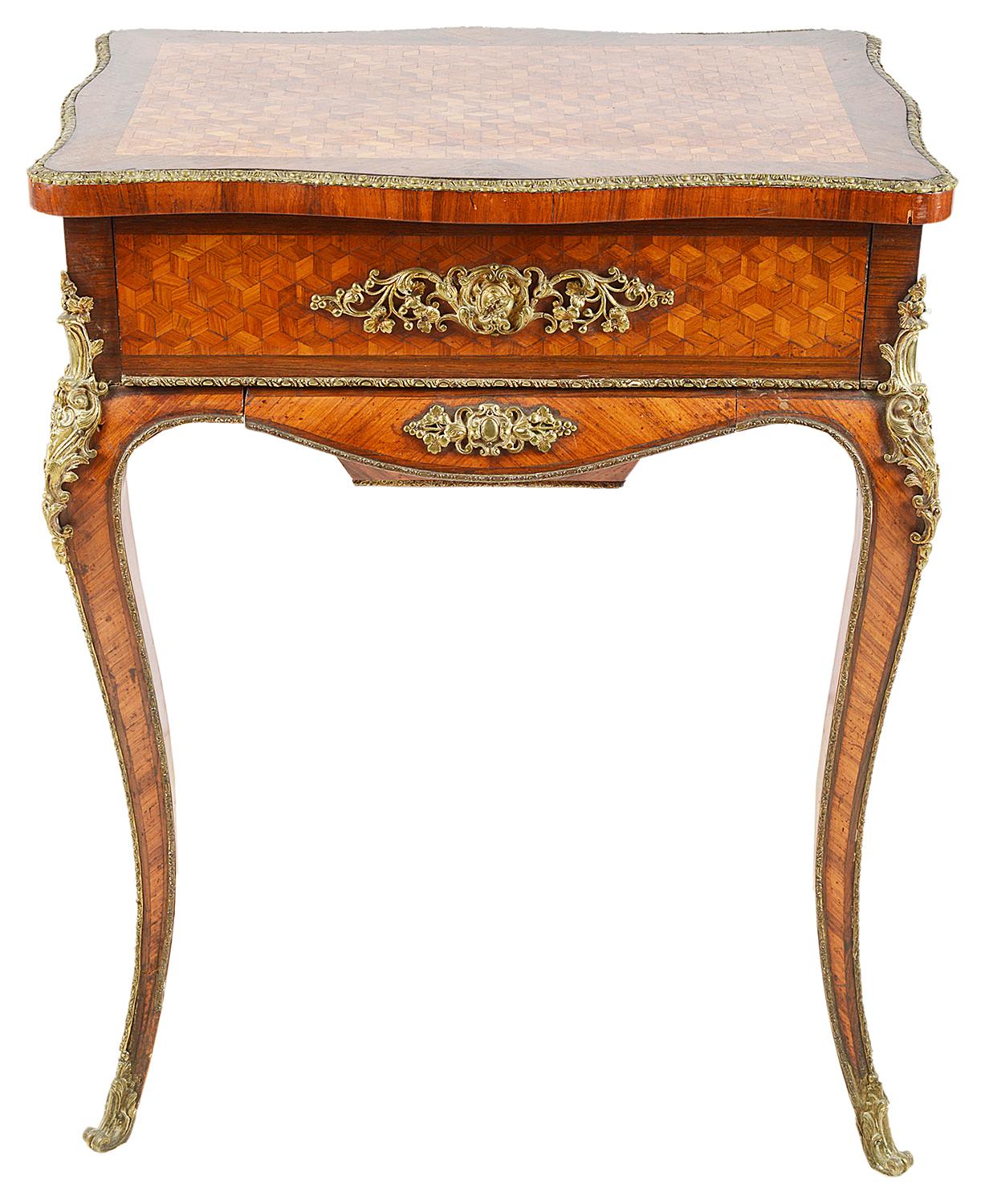 A very good quality late 19th century parquetry inlaid side table, having a hinged top, opening to reveal compartments within, gilded ormolu mounts and raised on elegant cabriole legs, terminating in scrolling ormolu feet.
