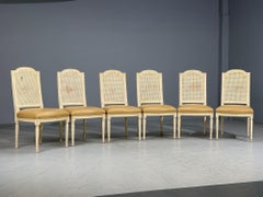 Stile Louis XVI, sei sedie da pranzo, legno dipinto, canna, pelle, 20° secolo.