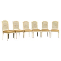 Stile Louis XVI, sei sedie da pranzo, legno dipinto, canna, pelle, 20° secolo.