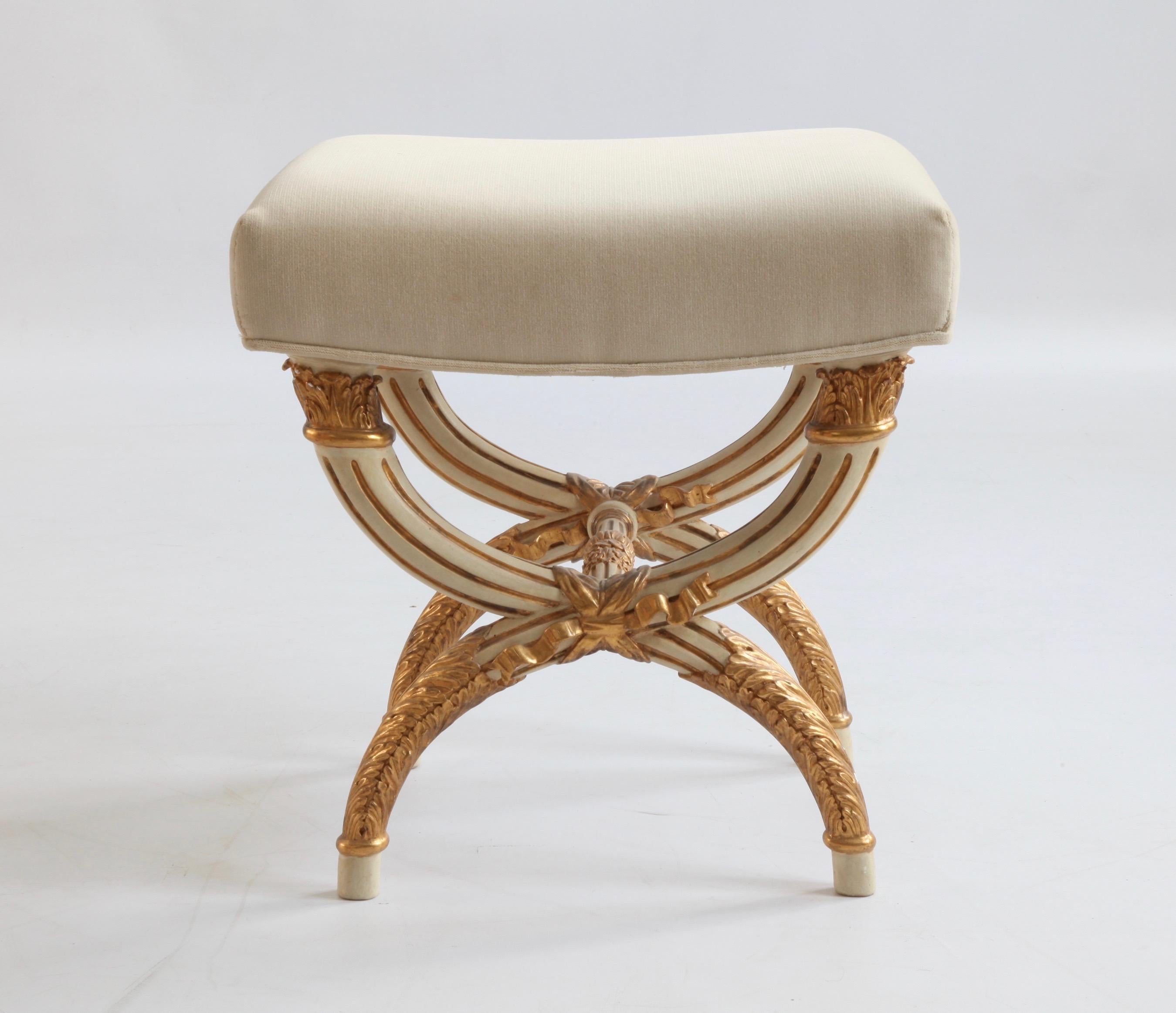Louis XVI style stool X-shaped stool made by La Maison London.
Fine carving all around, upholstered in a warm grey velvet.