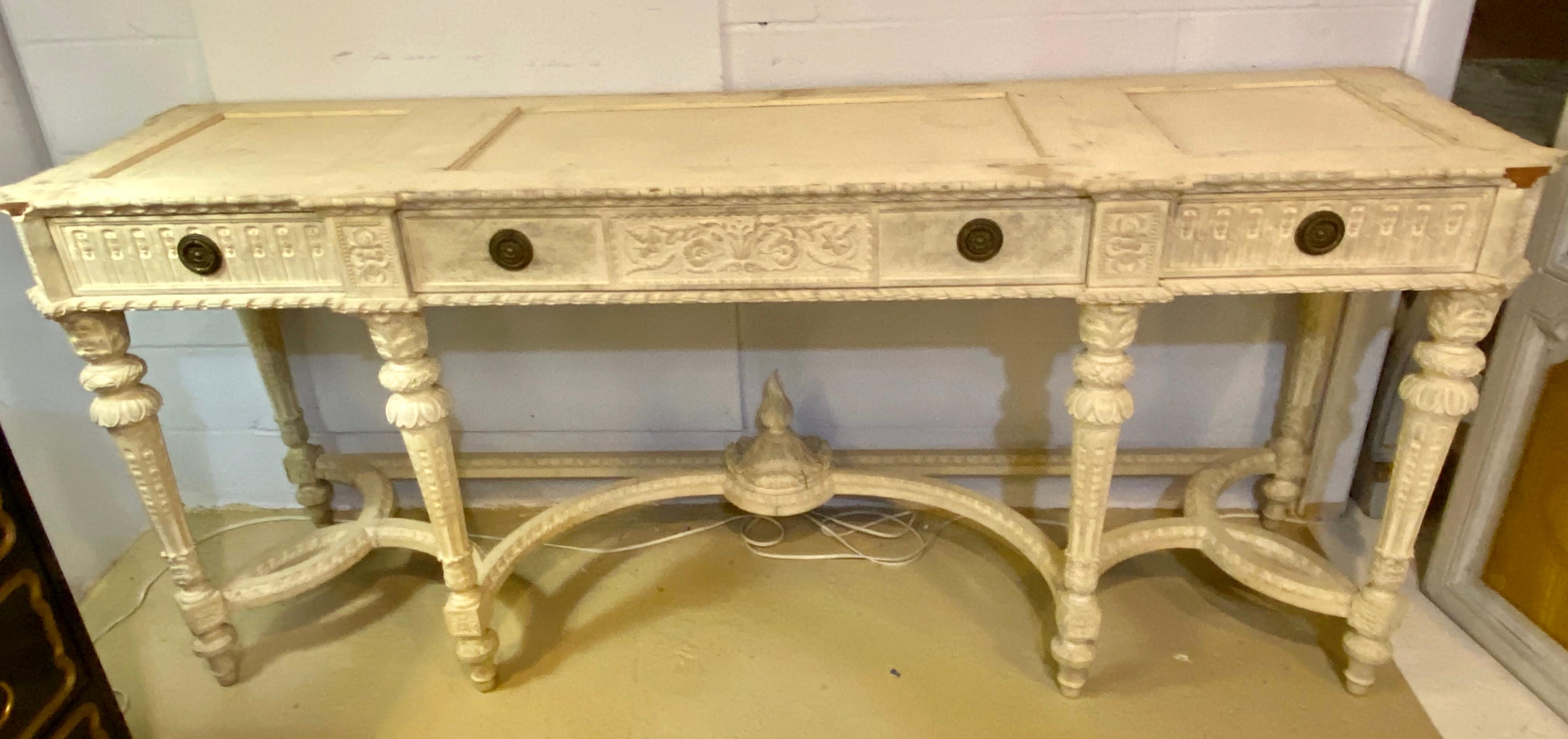 A Louis XVI style Swedish painted sideboard, console or serving table. A simply stunning 19th-early 20th century French console table having a rouge, gray and white 1.75 inch thick marble top. The top supported by a set of six finely carved gray /
