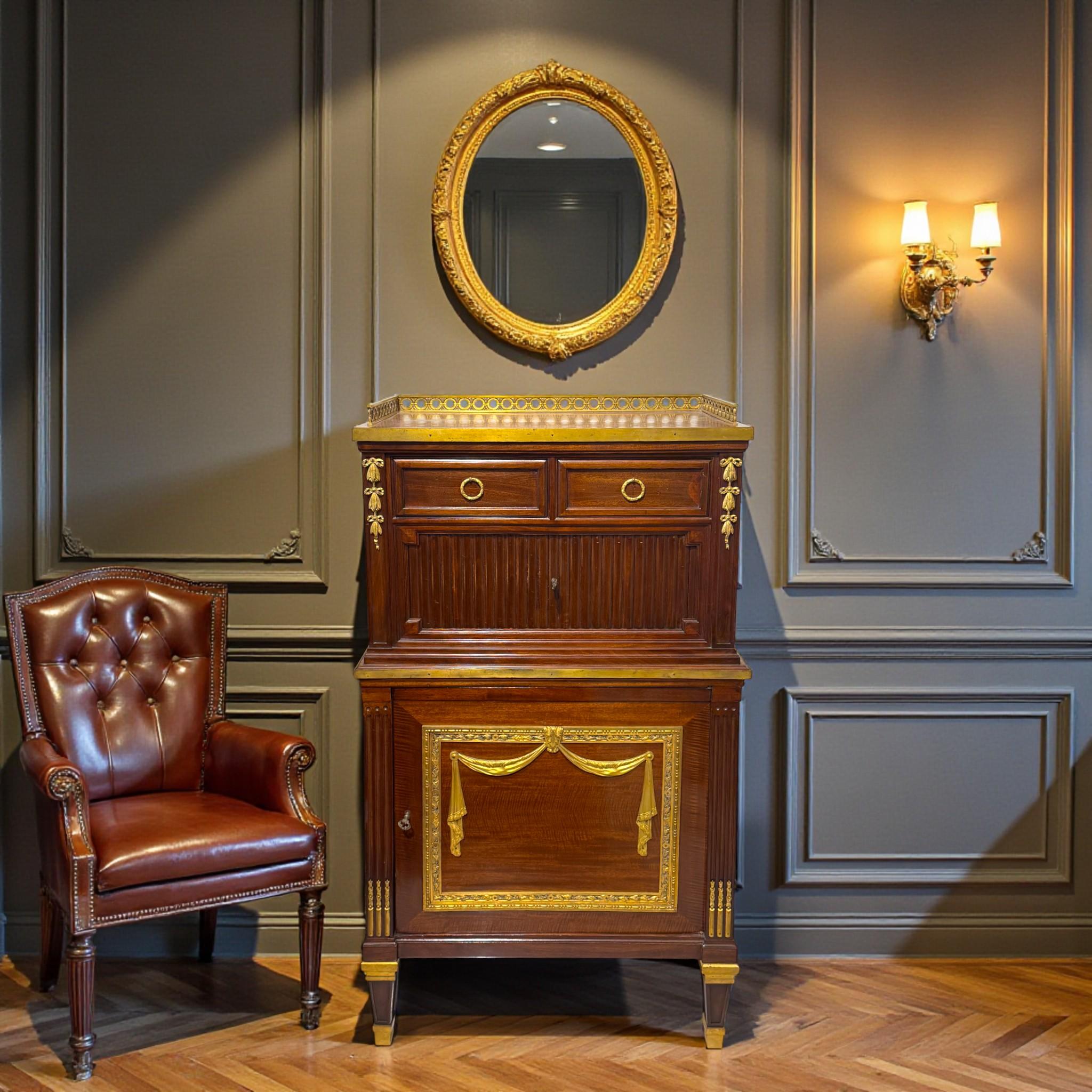 This elegant Louis XVI�–style bureau cabinet dates from the Napoleon III period, late 19th century, and exemplifies the refined craftsmanship of the great Parisian ébénistes. Crafted in richly figured mahogany, the piece is beautifully appointed with