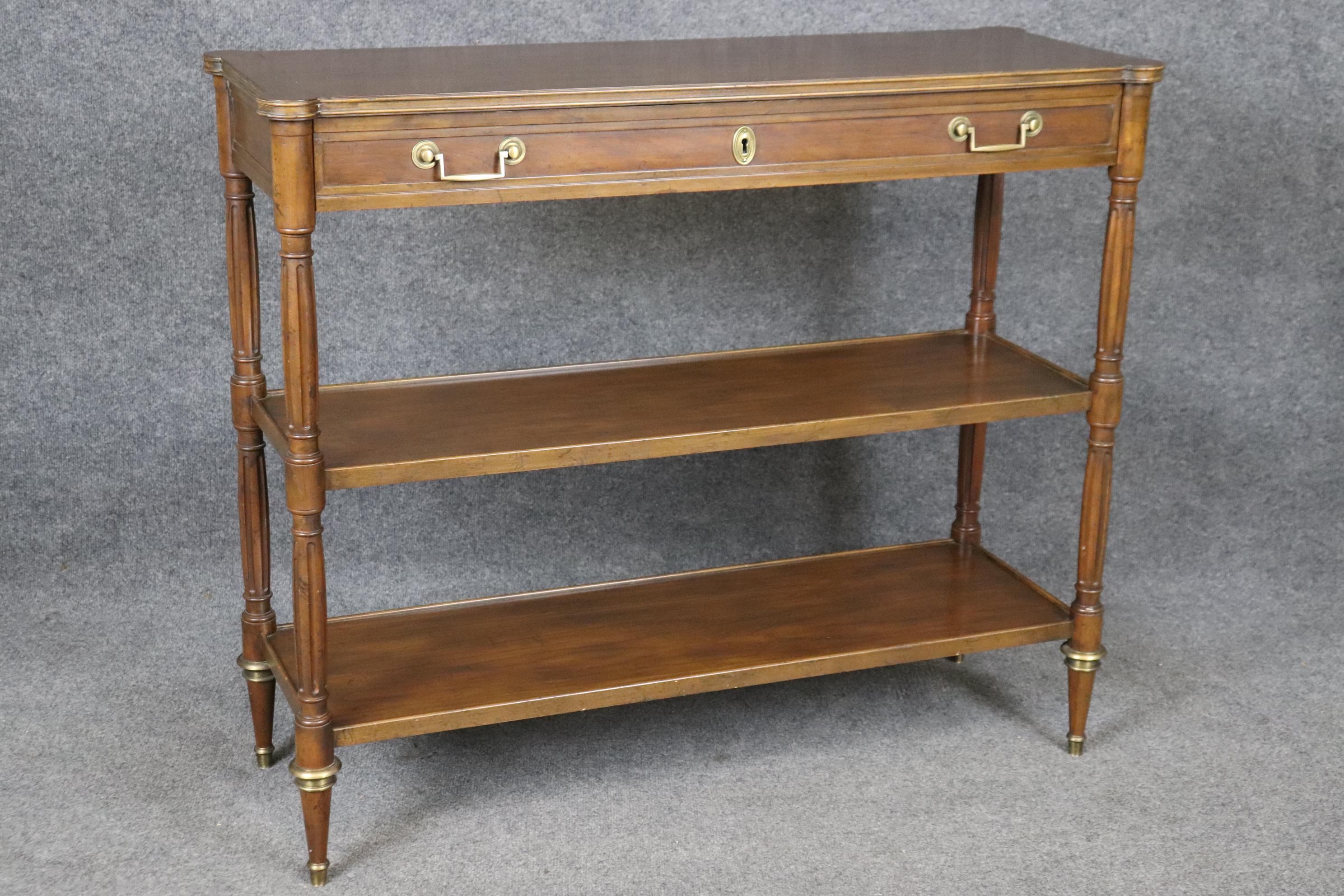 Dimensions - H: 36in W: 42 3/4in D: 15in 

This vintage French Louis XVI style console table by Baker Furniture Co. is a lovely piece of furniture that is a great example of quality furniture in the mid 20th Century. If you look at the photos