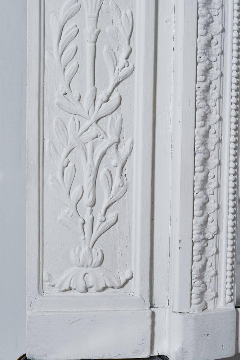 Early 20th century LXVI style Trumeau original purchased in Paris. Gesso and painted white with original mirror installed.
Overall size: 73 3/4