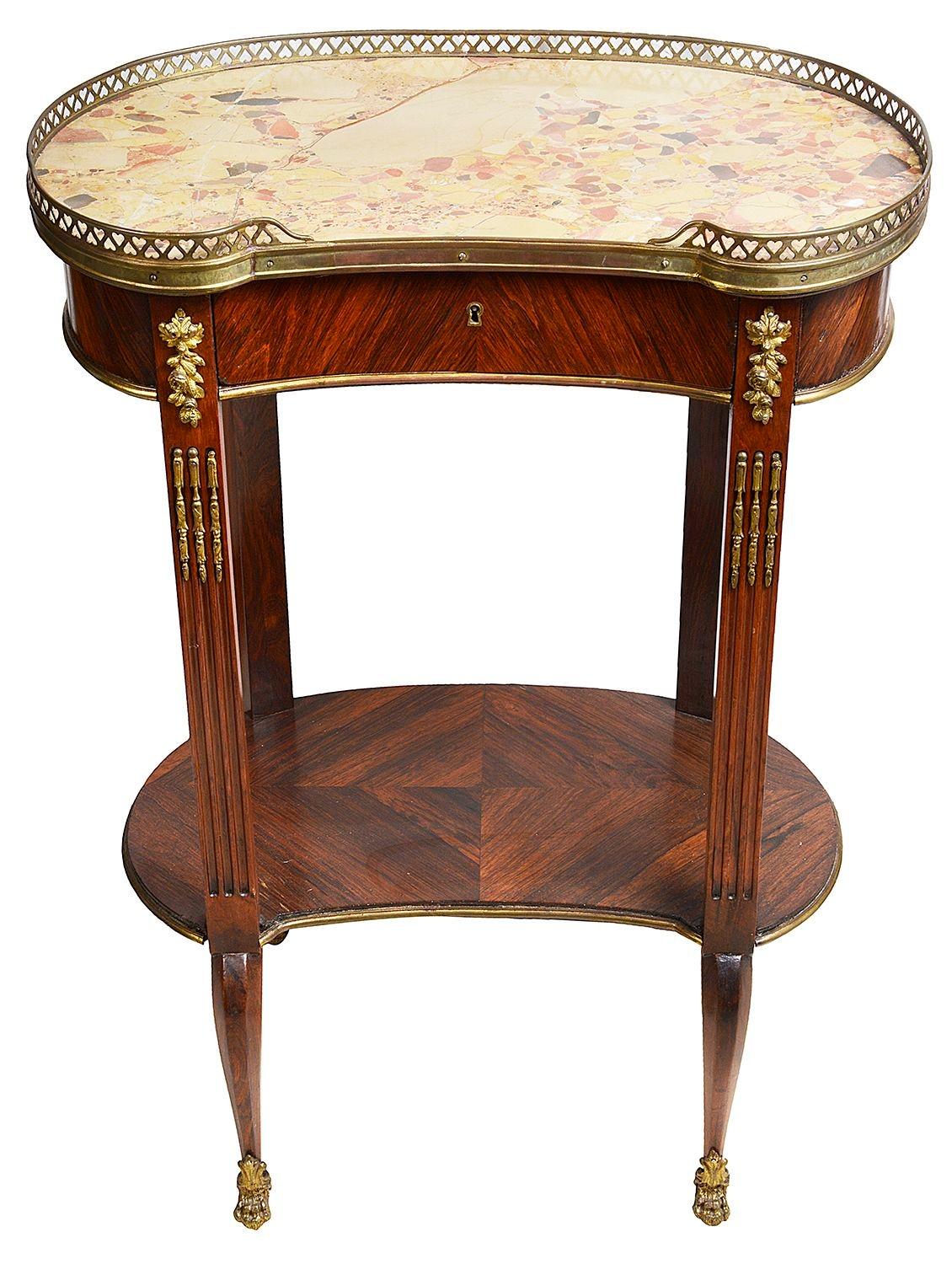 A good quality late 19th Century Louis XVI style marble top, kidney shaped side table, having a a brass gallery to the top, a frieze drawer, an under tier and raised on cabriole supports.

Batch 78 N/H