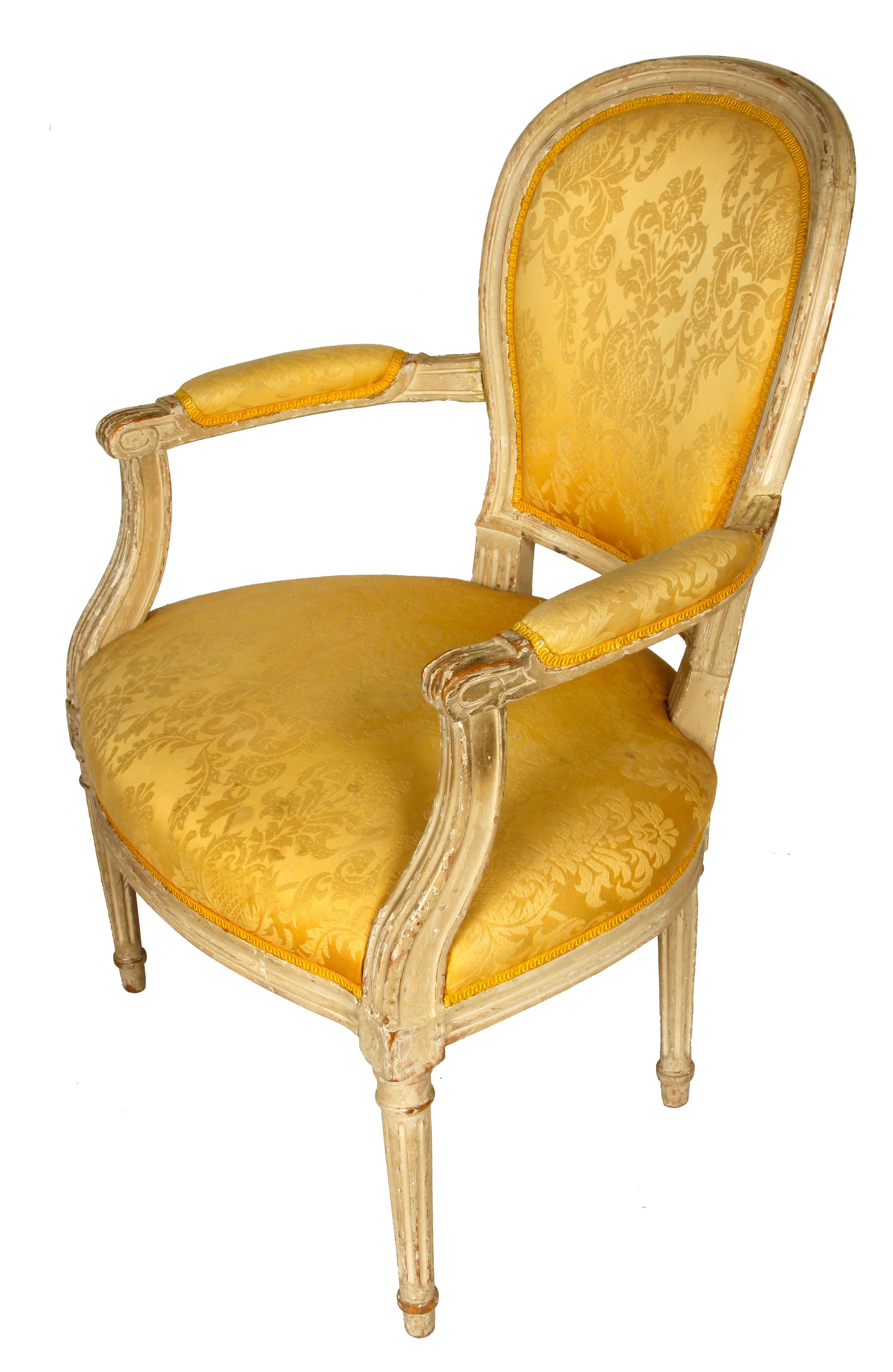 Louis XVI style upholstered armchair in yellow damask.