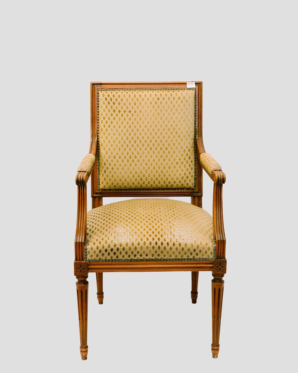 Louis XVI style carved walnut dining chairs, French, early 20th c., tacked, velvet upholstery with tapered, fluted cylindrical legs with rosette detail. Sides- H.- 36 1/4 in., W.- 19 1/2 in., D.- 19 in., Fauteuil- H.- 38 1/4 in., W.- 21 in., D.- 22