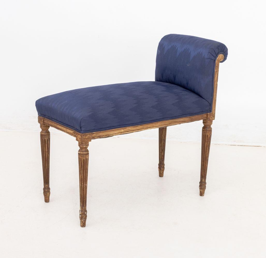 Pair of Louis XVI Style Navy Blue Upholstered Window Seats, each with one scroll arm atop fluted legs. 27