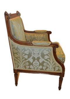 Louis XVI style walnut bergere with green damask silk fabric.
