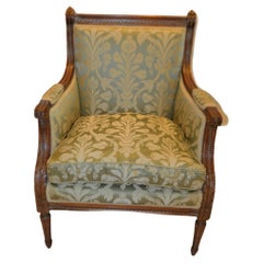 Louis XVI style walnut bergere with green damask silk fabric.