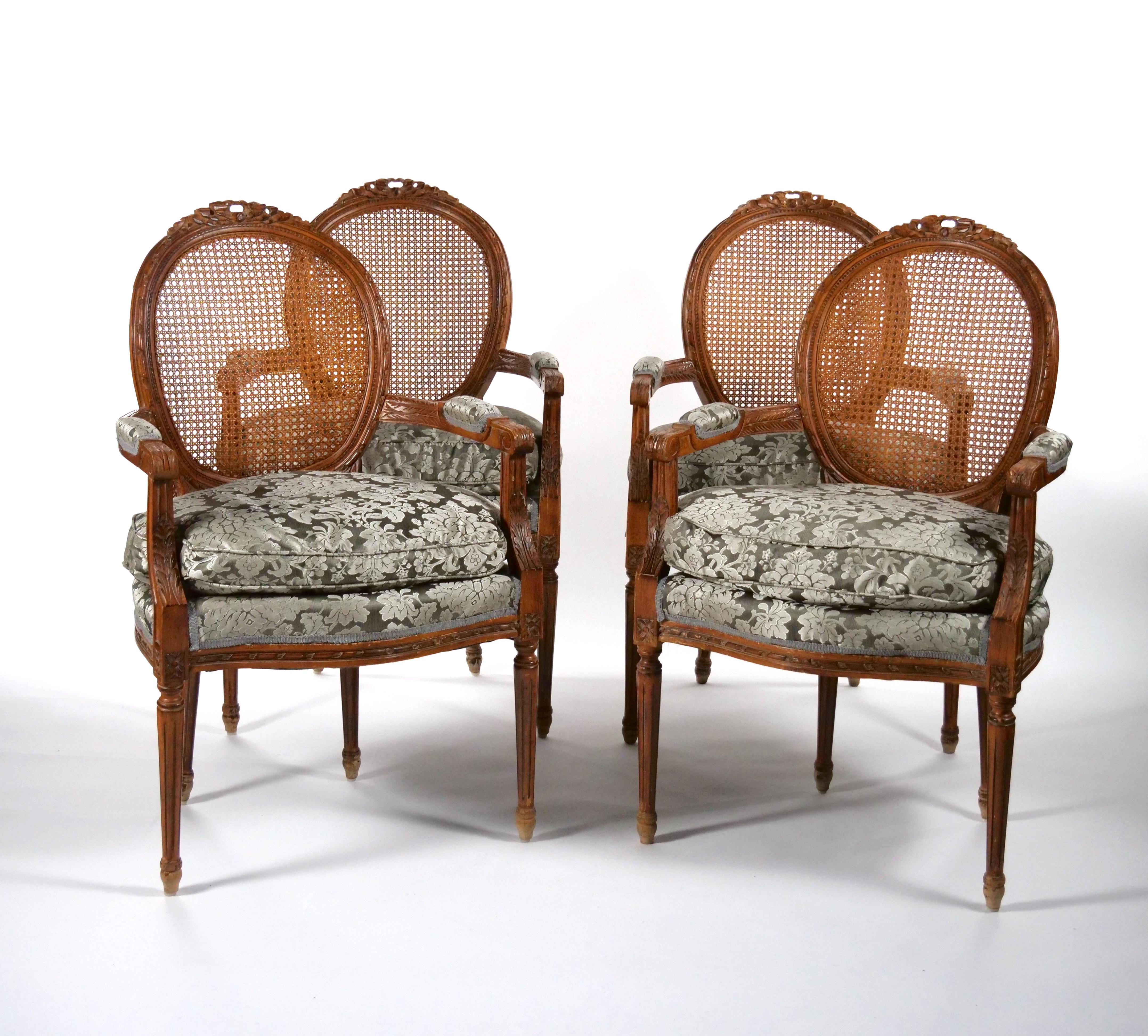 fine quality and beautifully hand carved and hand woven with wood frame floral decoration set of four armchair / bergere. Each armchair features a wood frame decorated with hand carved floral design , resting on four round carved feet decoration.