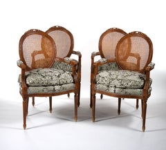 Louis XVI Style Walnut Caned Needlepoint Lounge Chairs