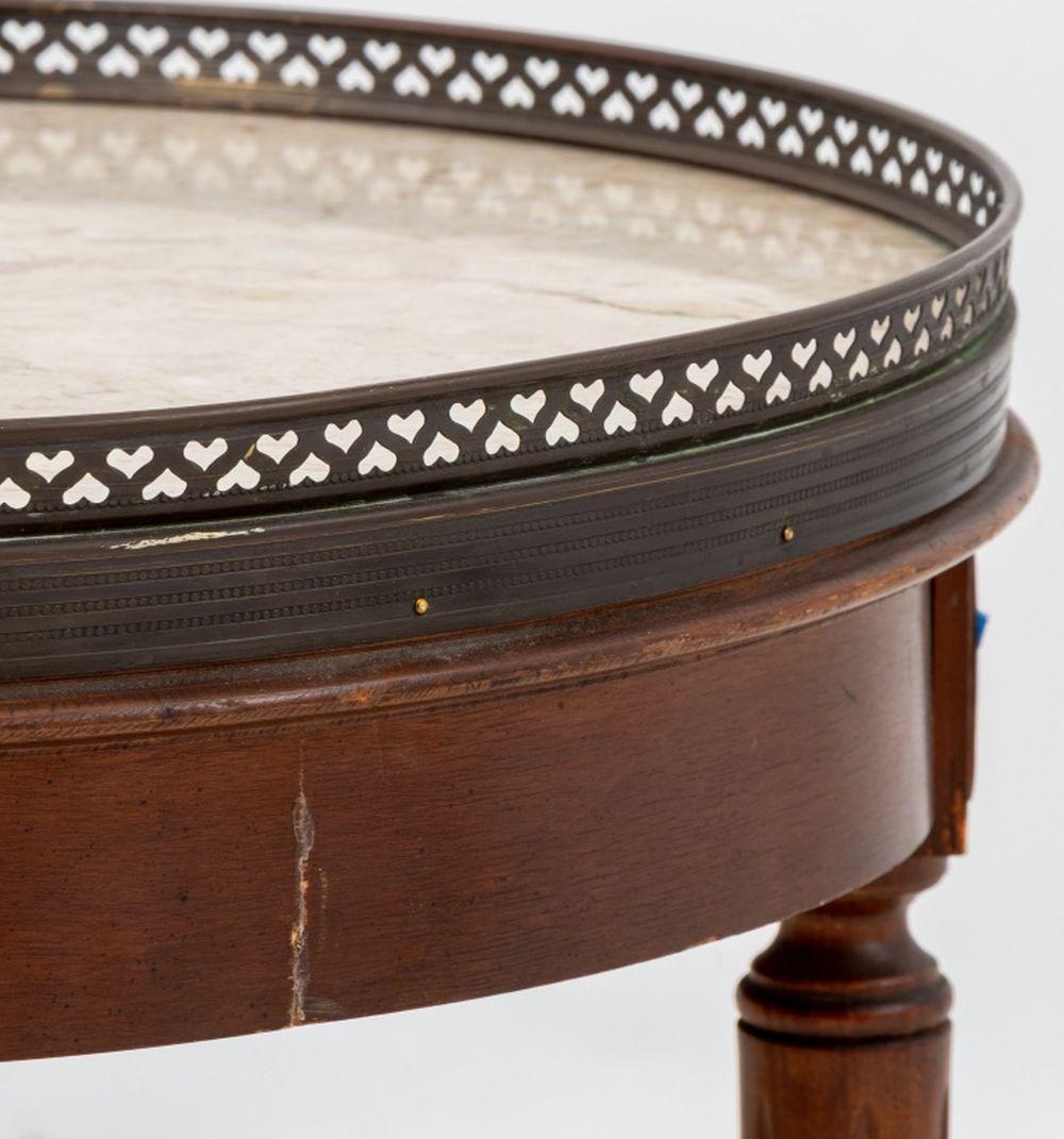 Louis XVI Style Walnut Marble Top Circular Table, with pierced brass galleried top, with single drawer on fluted tapered legs with brass tipped feet. 22.5