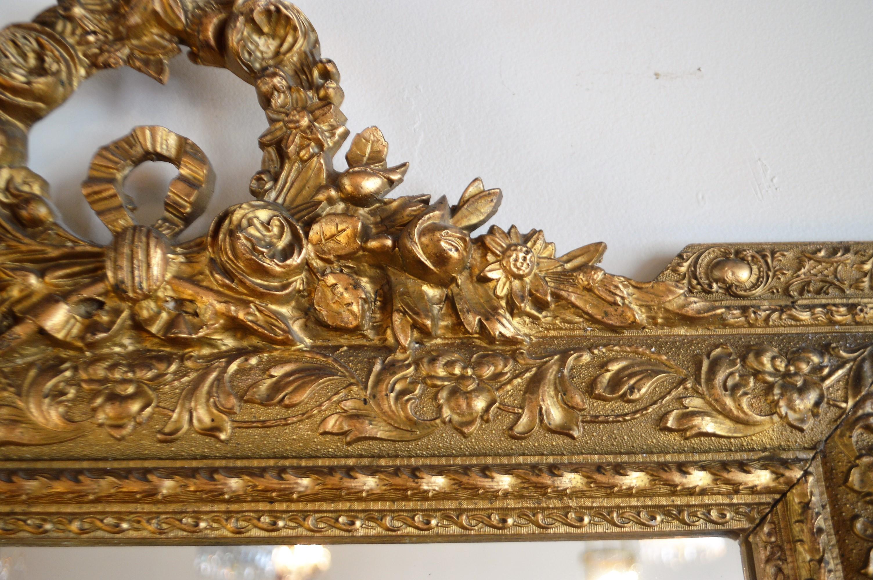 French Louis XVI Style Wood Gilded Mirror with Wreath Decorative Top and Carved Frame