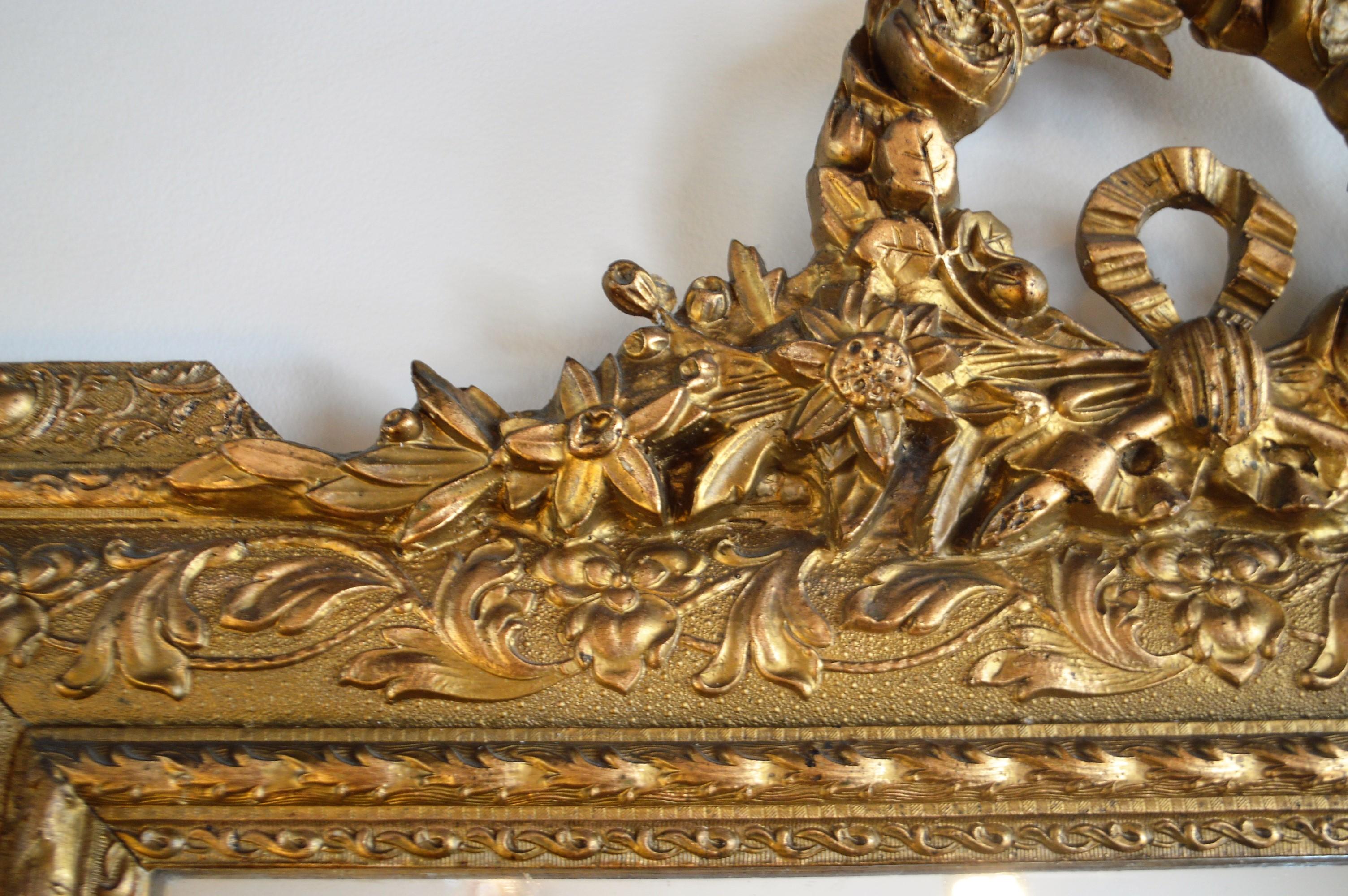 Gilt Louis XVI Style Wood Gilded Mirror with Wreath Decorative Top and Carved Frame