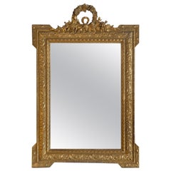 Louis XVI Style Wood Gilded Mirror with Wreath Decorative Top and Carved Frame