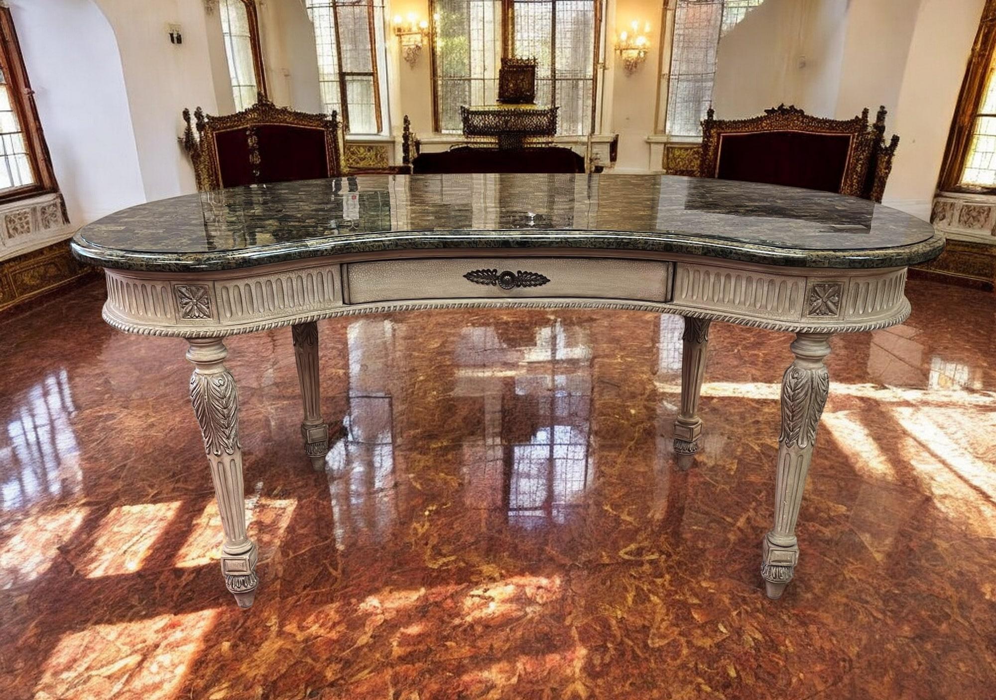 This kidney-shaped desk is a beautiful example of the Louis XVI style, popular in France during the late 18th century. It features a curved front and sides, with delicate carving details. The single drawer offers storage for writing supplies, while