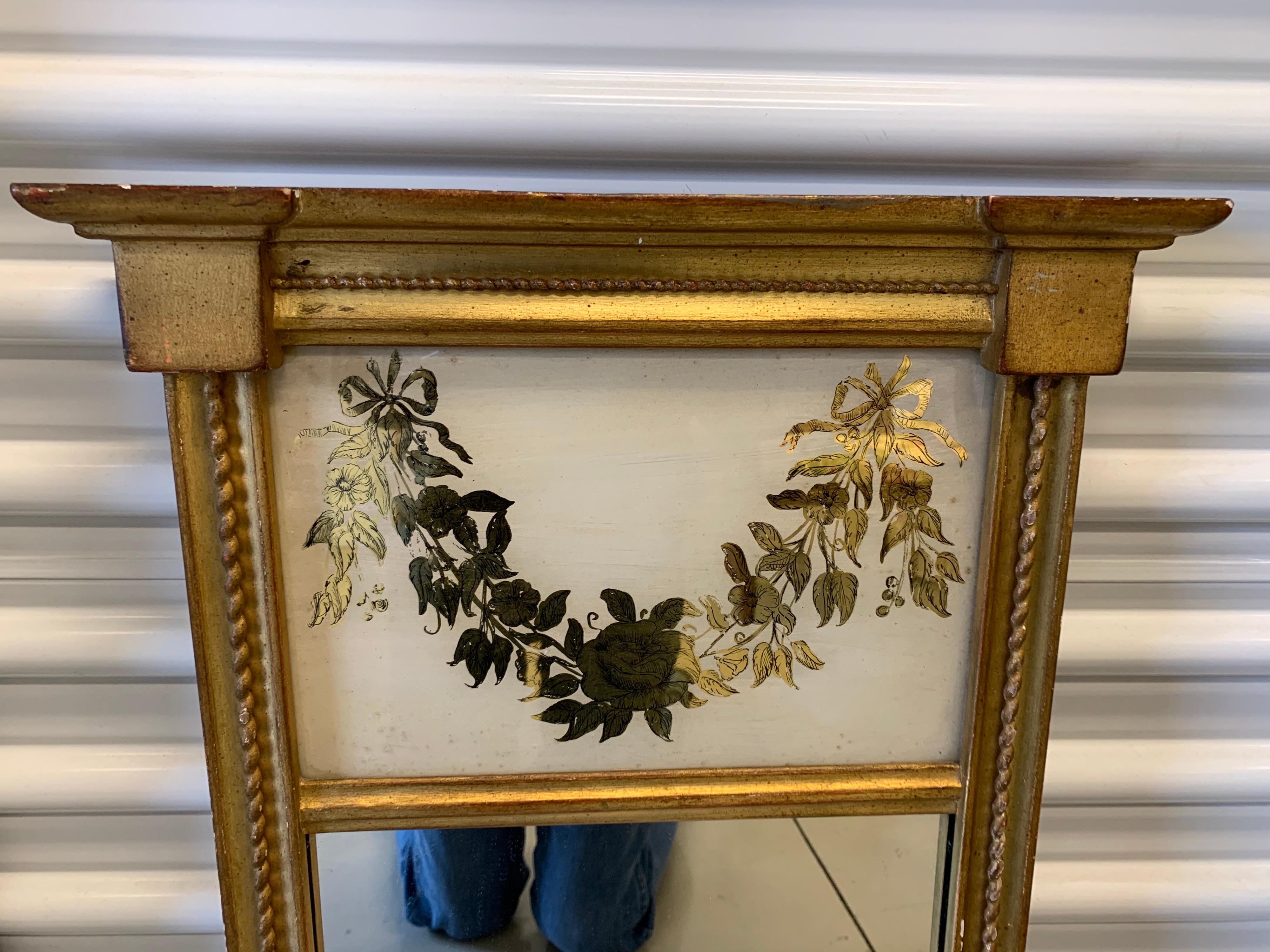 Great scale on this giltwood antique Trumeau mirror with etched gold floral motif above mirror.
Perfect for parlor, bathroom or study in your home.