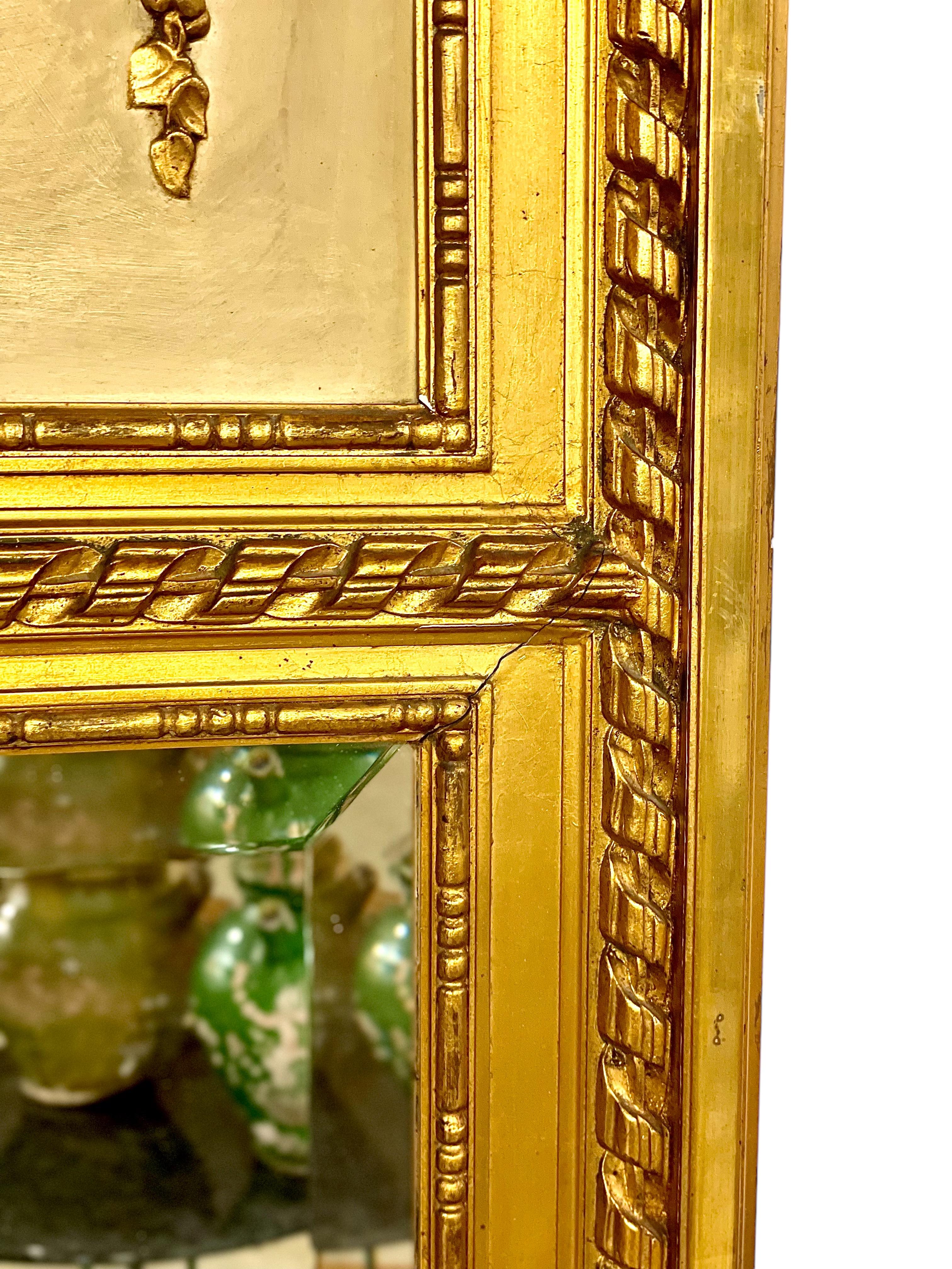 Giltwood  19th Century Louis XVI Trumeau Gilded Mirror with Mischievous Cherubs Design For Sale