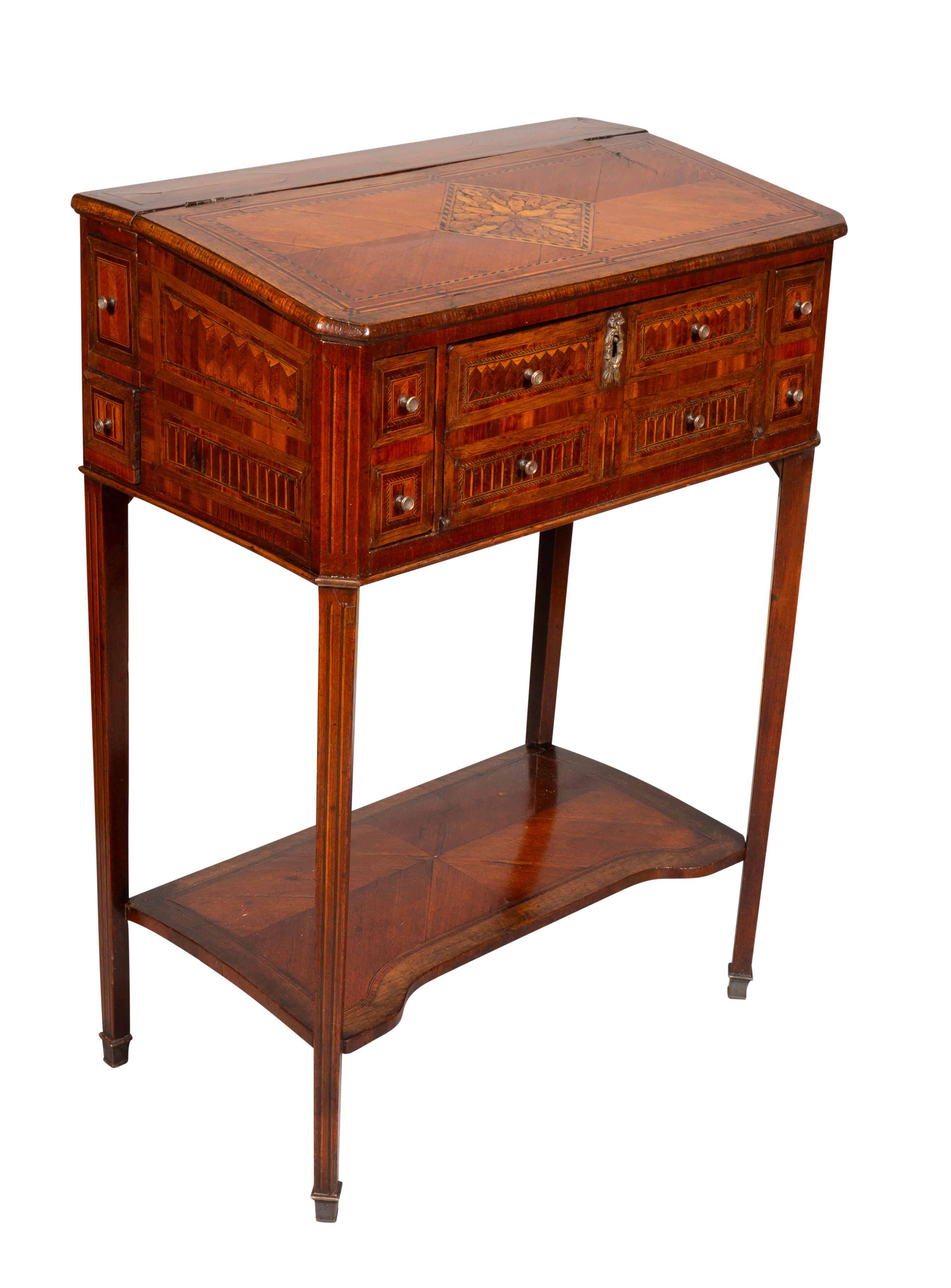 Small work table of small scale to decorate a hall way or a small space. With many drawers and compartments. Lower shelf. Sabot feet. J.P Morgan Provenance.