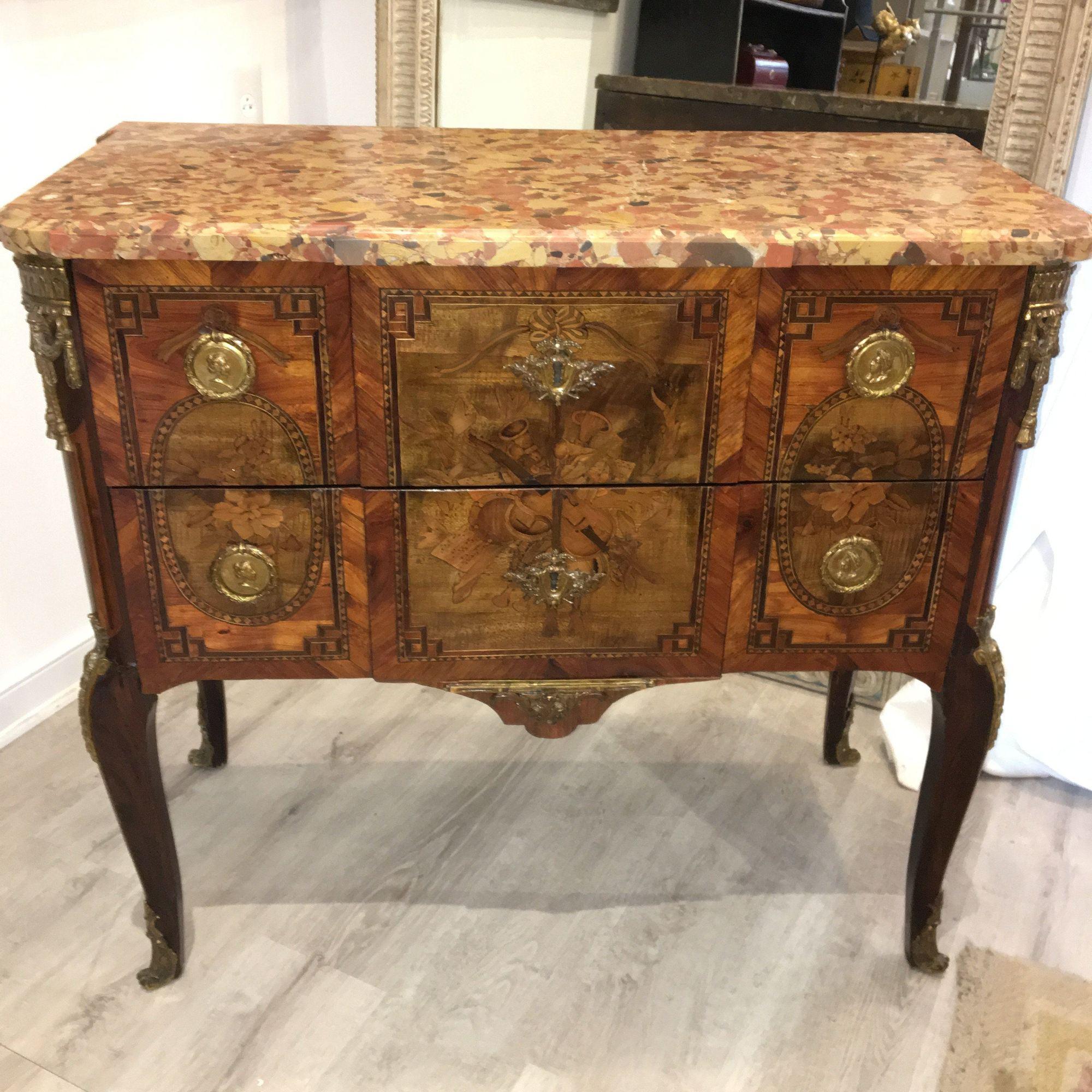 Exquisite 18th century Louis XVI transitional two-drawer commode, made by the Parisian ebonist Francois Rubestuck, circa 1765. Tulip-wood and kingwood having marquetry inlay and medallion cast bronzes, with rare Breche d'Alep marble top. Stamped:
