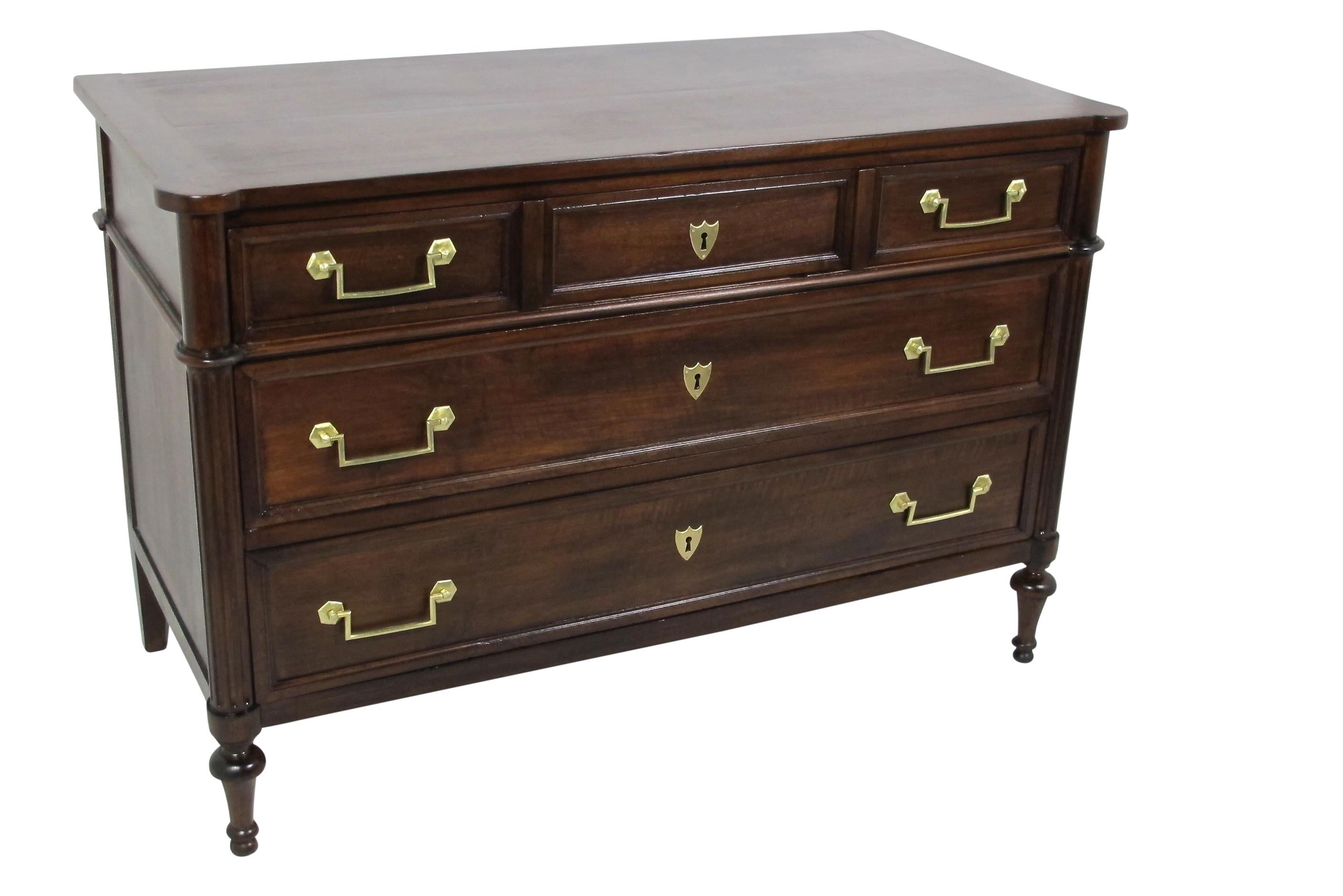 Walnut commode or chest of drawers, having a single drawer with three faux drawer facades over two long drawers, supported on curved and fluted stiles sitting on turned toupee feet. Original walnut top and brass pulls. Recently restored, French,