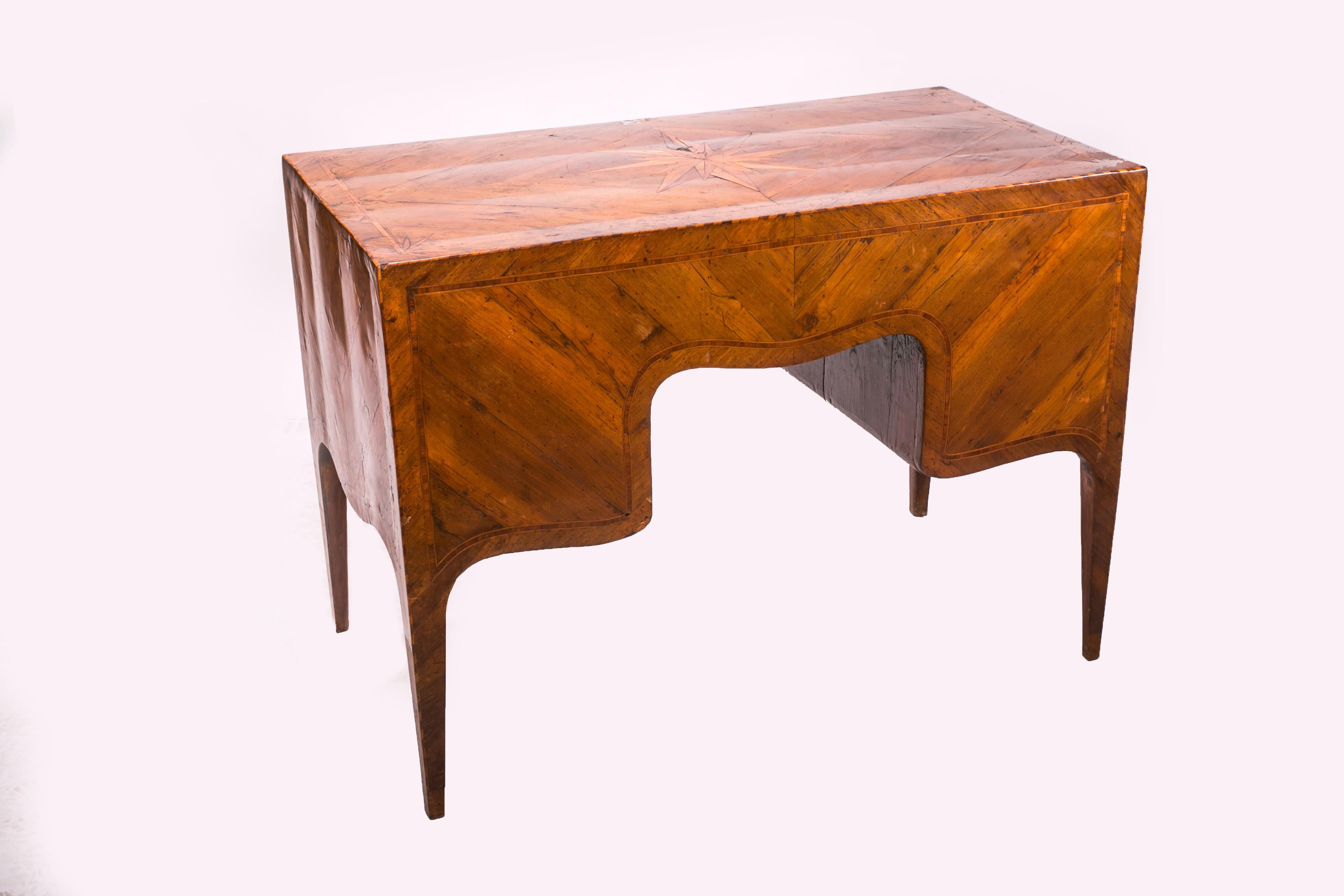 Elegant Louis XVI writing desk with pull-out writing surface, inlaid on the top with a compass rose.

Elegant writing desk with pull-out writing surface, inlaid on the top with a compass rose.
Louis XVI style desk veneered in walnut with maple and