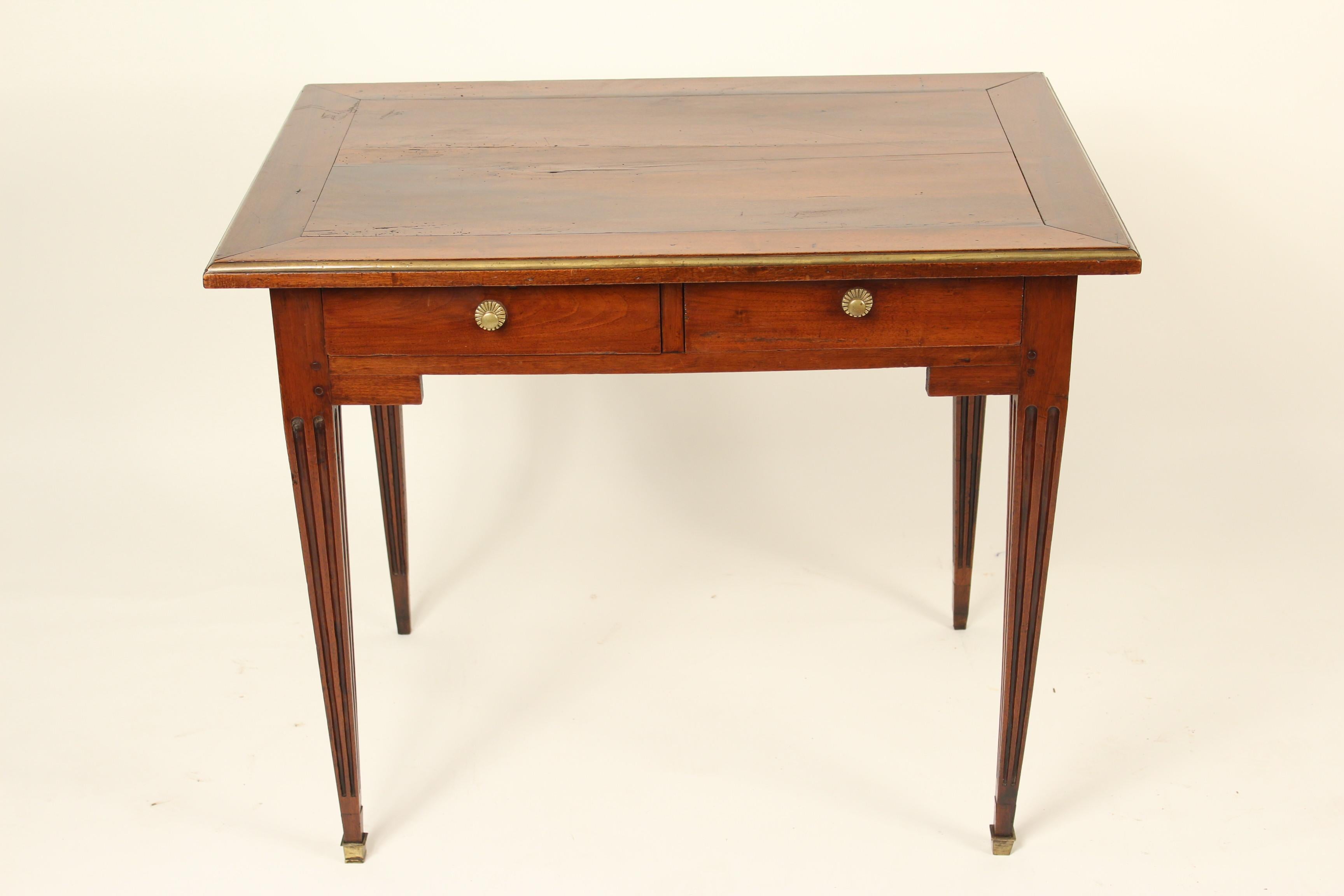 Louis XVI mahogany writing table / occasional table, circa 1800. Mahogany has nice old patina, the top has brass trim going around it.
