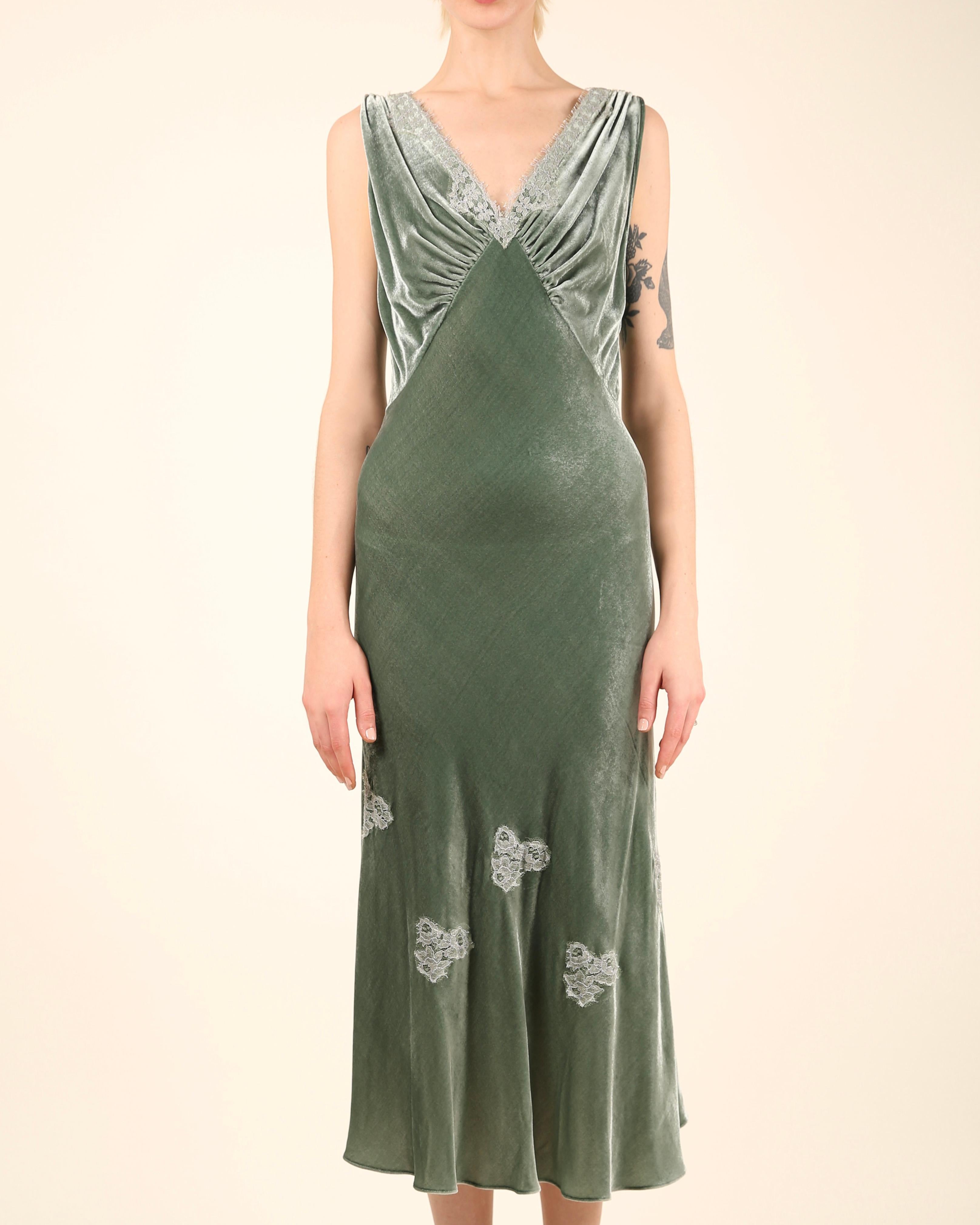 LOVE LALI Vintage

A lovely sleeveless midi length dress by Louis Beccaria in a shade of muted sea foam green velvet 
It has beautiful lace trim in silver lurex to the V neckline and very low V back, as well as little areas of lace detail to the