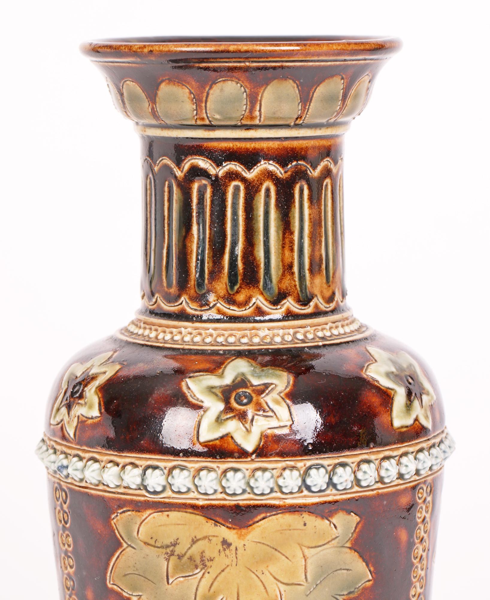 A stunning and early Doulton Lambeth Aesthetic Movement vase decorated with panels containing stylized floral designs by renowned artist Louisa E Edwards and dated 1876. 

Louisa Edwards was one of the mains artists at Doulton Lambeth and was