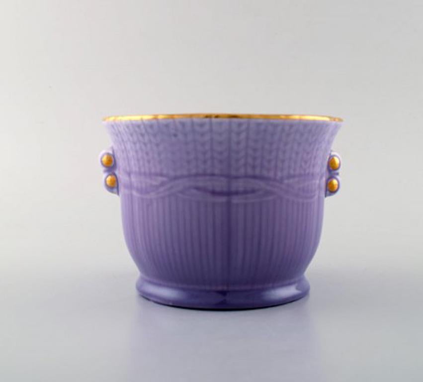 Louise Adelborg (b.1885, 1971) for Rörstrand / Rørstrand, Sweden. Set of four Swedish Grace flower pots in purple with gold decoration. 1930 / 40s'.
Louise Adelborg was a Swedish designer of porcelain and textiles. She worked for Rörstrand /