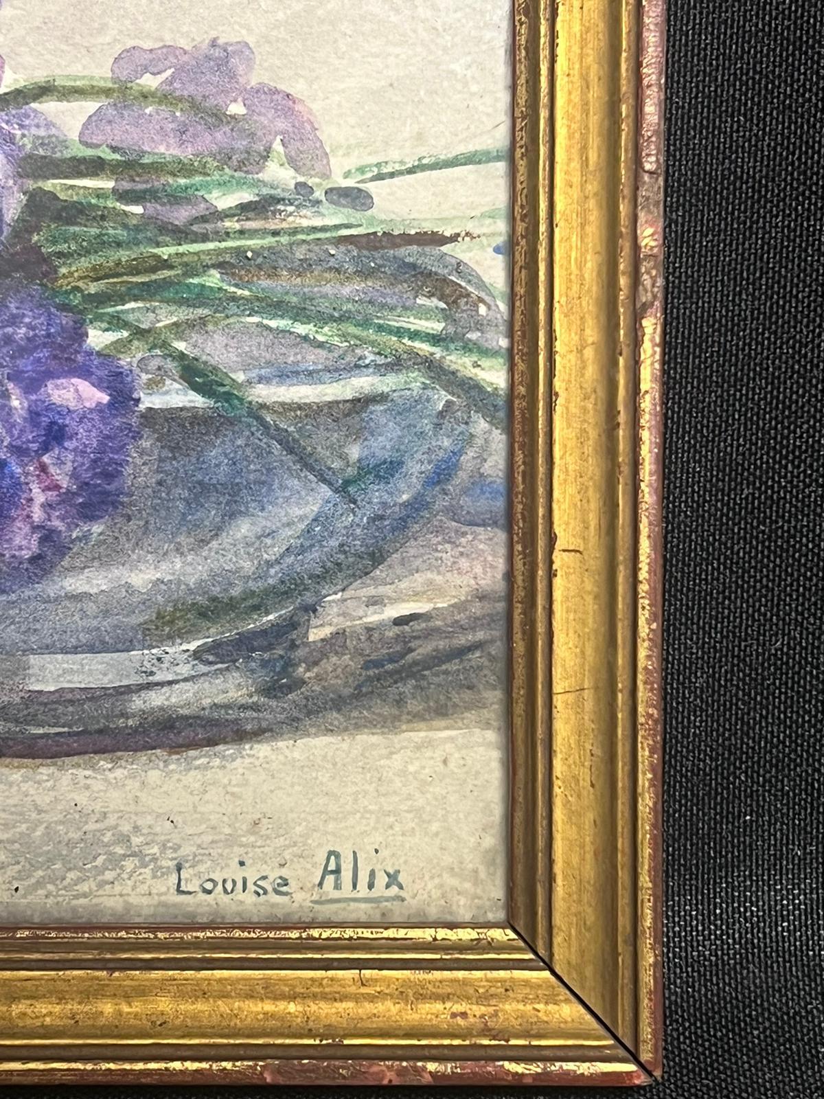 Iris
de Louise Alix (francesa, 1888-1980) *ver notas más abajo
sello de procedencia en el reverso 
vidrio sobre pintura
pintura en acuarela sobre papel de artista pegado sobre tabla, enmarcada
medidas del marco: 5 x 6,5 pulgadas
medidas 4,5 de alto