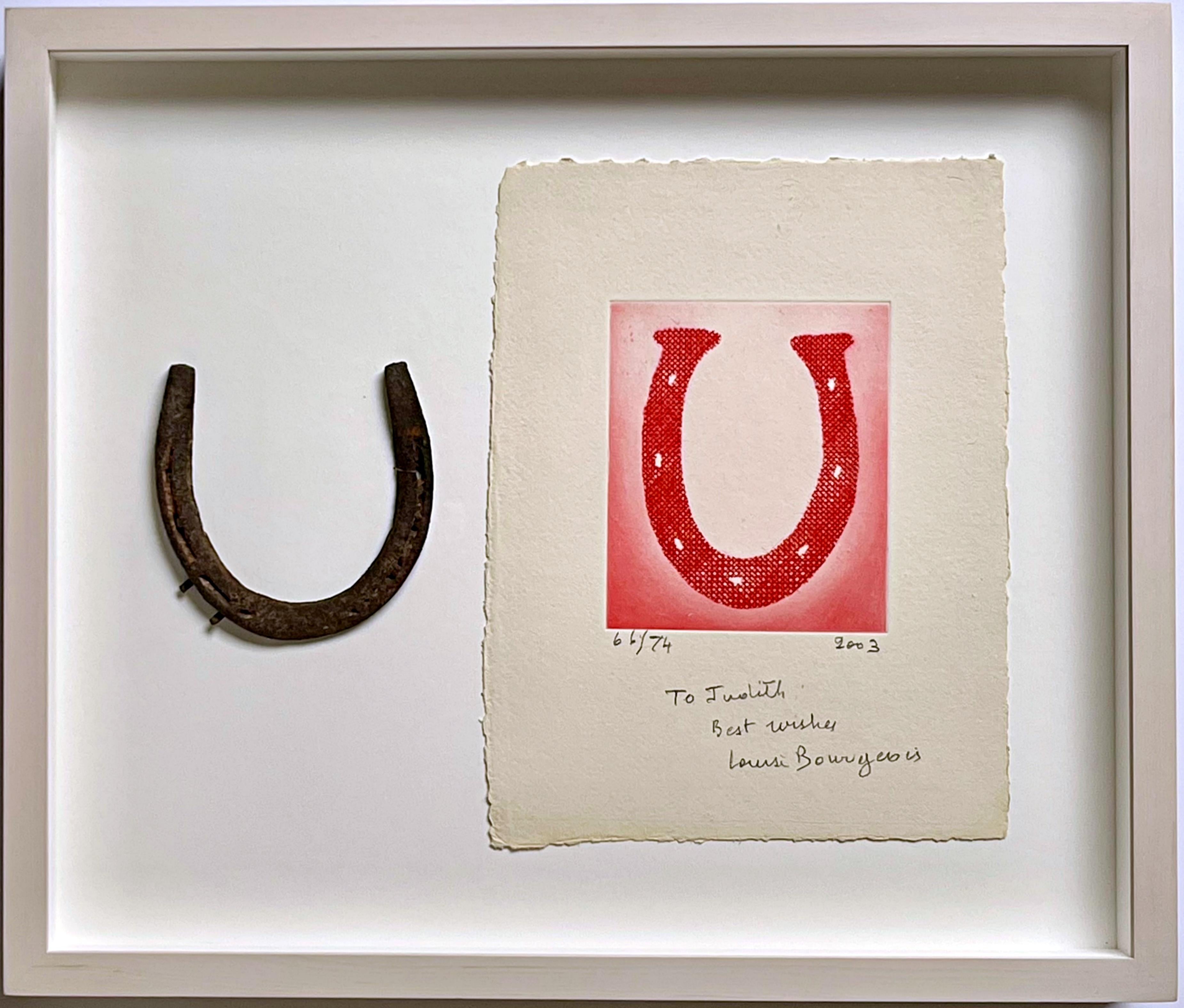Engraving by Louise Bourgeois, 2002, hand signed, numbered and inscribed to her longtime printer Judith Solodkin of Solo Impressions, accompanied by an actual horseshoe gifted by the artist, in a shadowbox frame. 
The horseshoe reinforces the image
