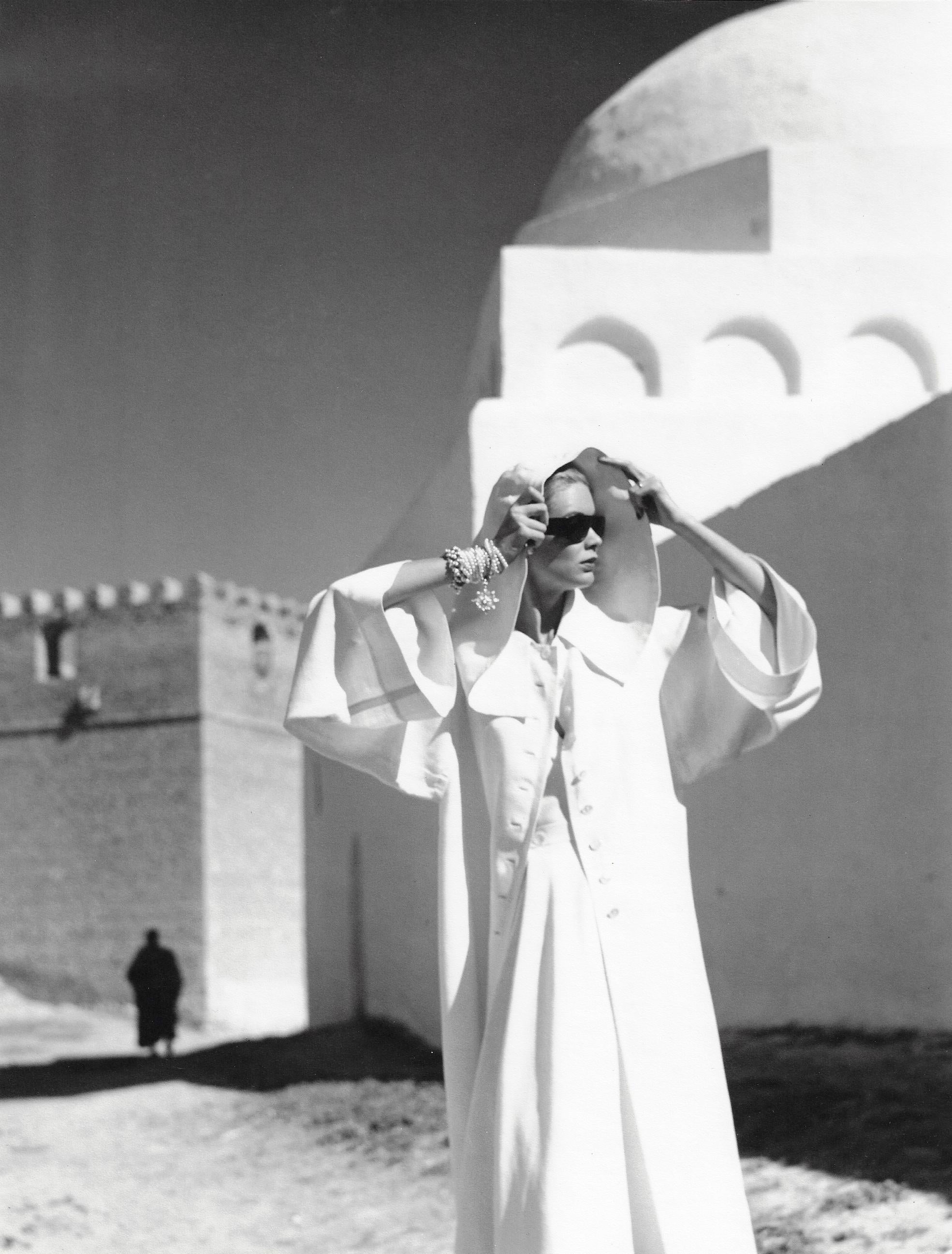 Natalie in Grès Coat, Kairouan - Photograph by Louise Dahl-Wolfe
