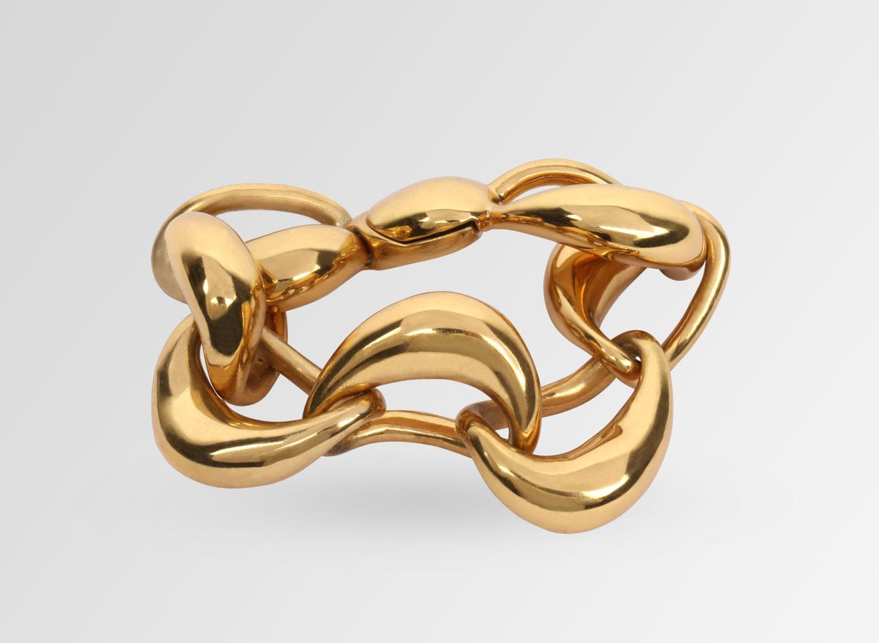 High polished 24 karat gold plated chain bracelet. 

Bold to look at yet light to wear, each link is hand-formed and then linked together. 
Fastened by a magnetic snap closure.

From the fourth series of jewellery designed by Louise Olsen for her