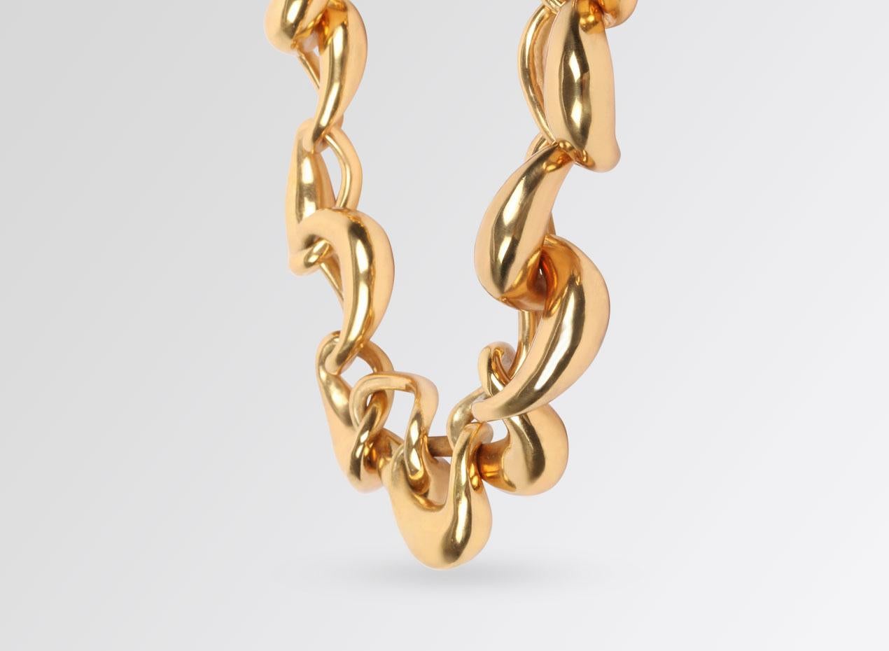 High polished 24 karat gold plated chain choker necklace. 

Bold to look at yet light to wear, each link is hand-formed and then linked together. 
Fastened by a magnetic snap closure.

From the fourth series of jewellery designed by Louise Olsen for