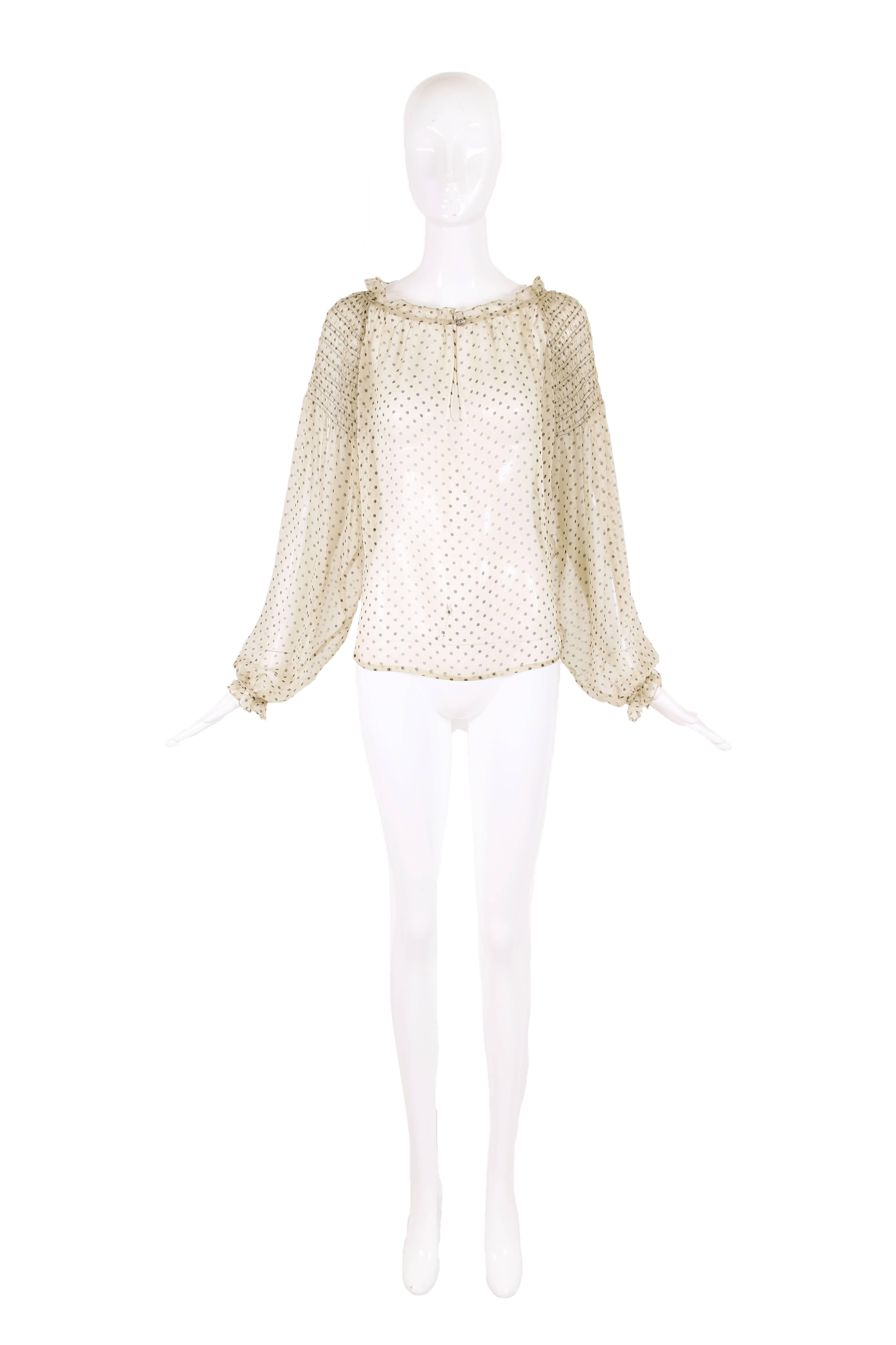Loulou de la Falaise sheer 100% silk chiffon peasant style blouse in pale yellow with black polka dots, rouching detail at the shoulders, ruffle trim at sleeves and neckline. In excellent condition with a tiny orange-ish mark at the neckline and