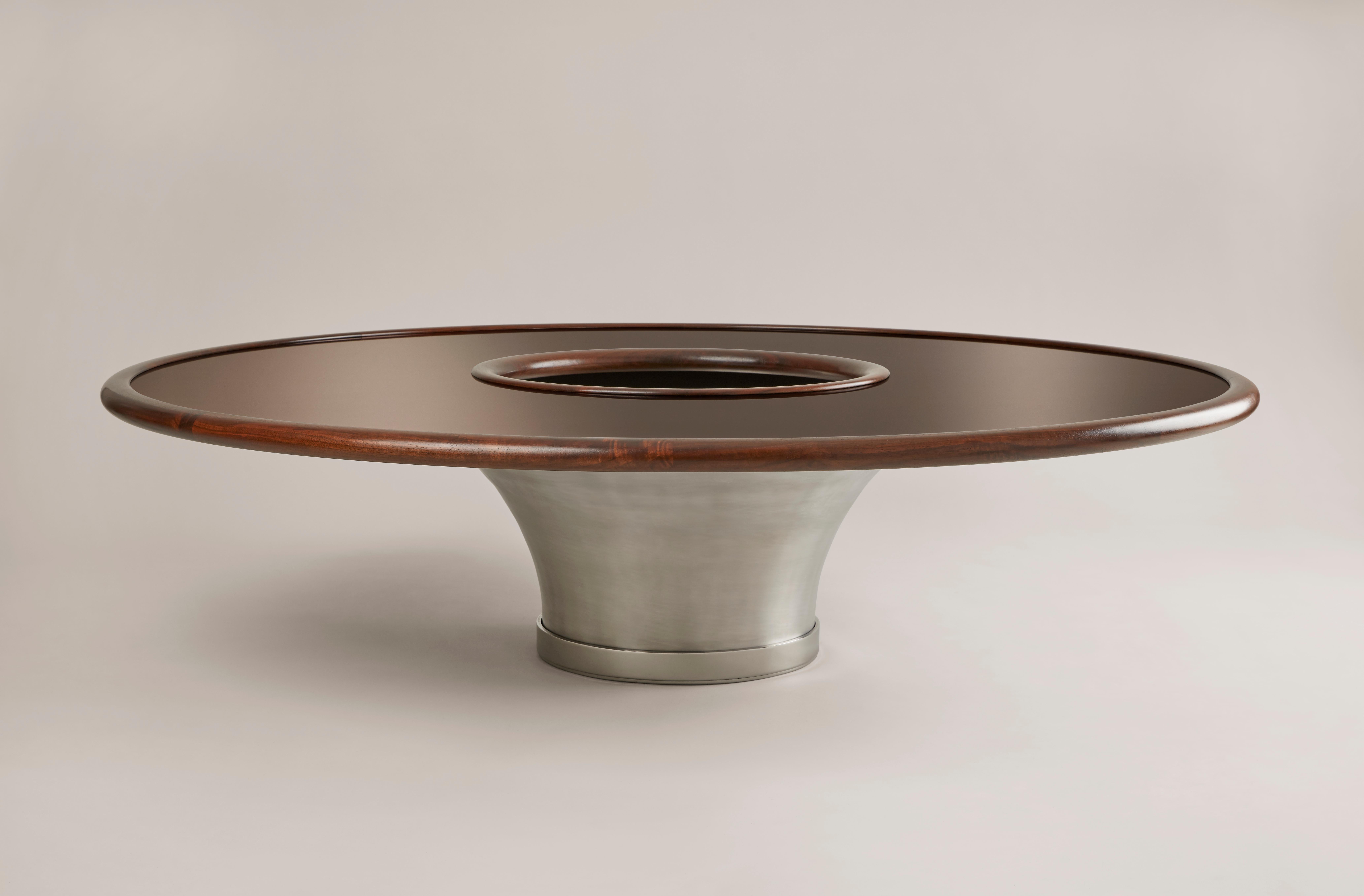 This end table is made of a large base of spun aluminium fixed on a stainless steel base board. The delicate table top is lacquered by the best craft mans of Paris in the pure art decorative's tradition. A satin walnut strapping protect this top