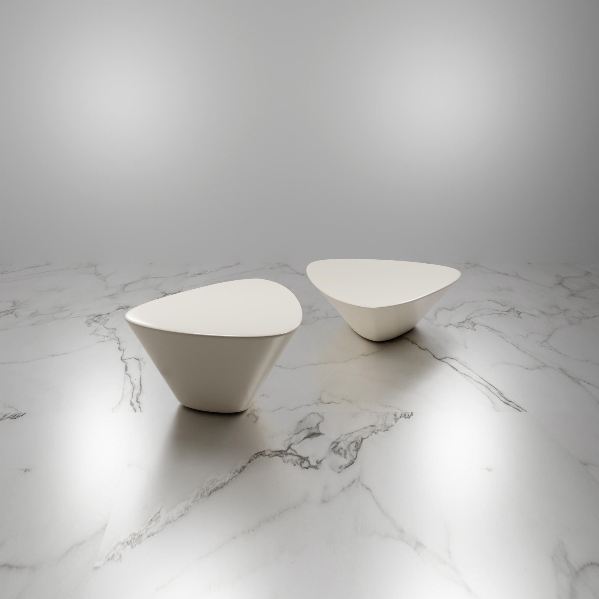 L22 is a low table as much as it is a sculpture to use and admire.

Inspired by the beauty and uniformity of the reclaimed trunk of the American Oak, with the organic ondulations of its rings of time that begin with an open knot of origin that