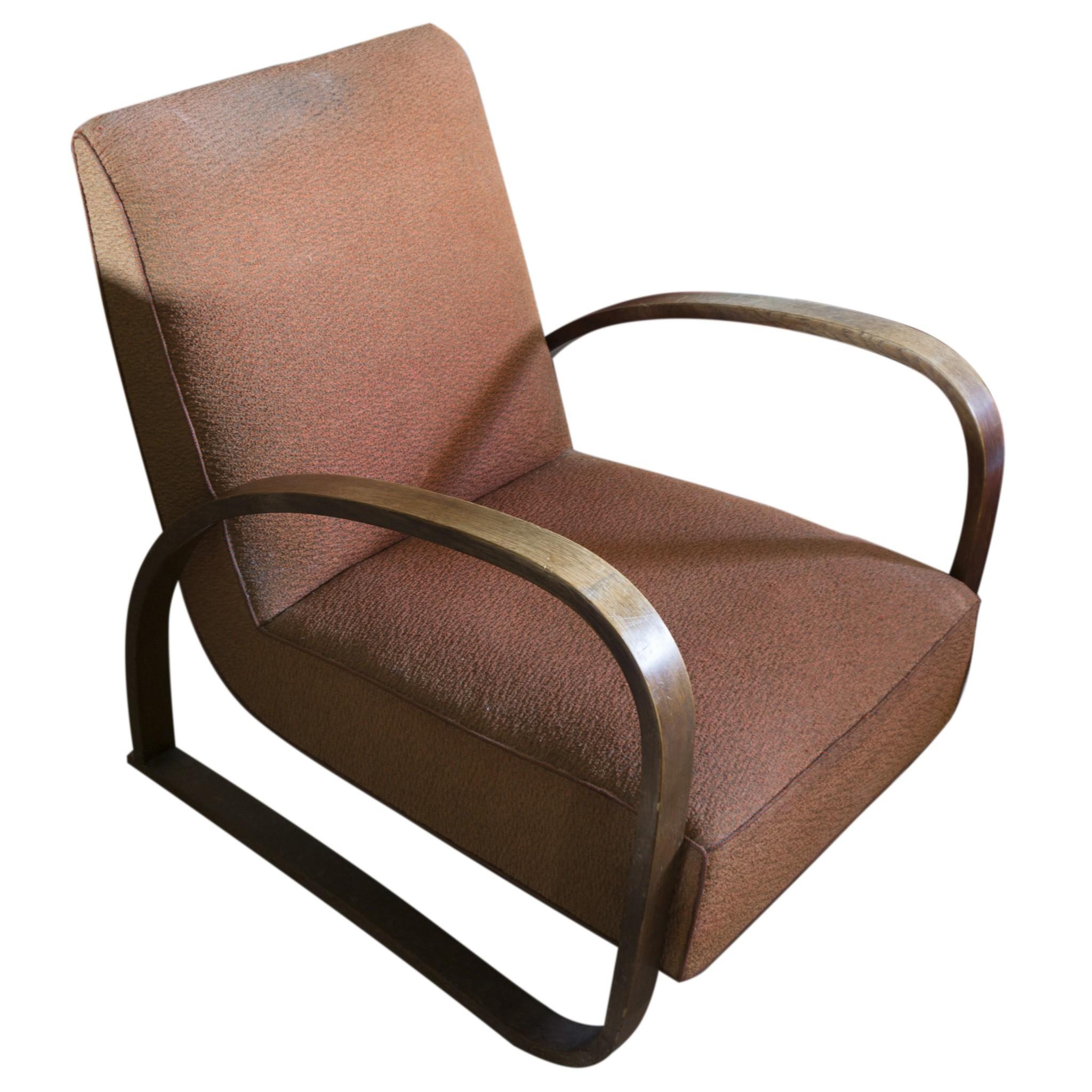 Art Deco ebonized bentwood armchair No. H-70 designed by Jindrich Halabala in the 1930s. it features an original upholstery. The wooden structure is in good original condition.
  
 