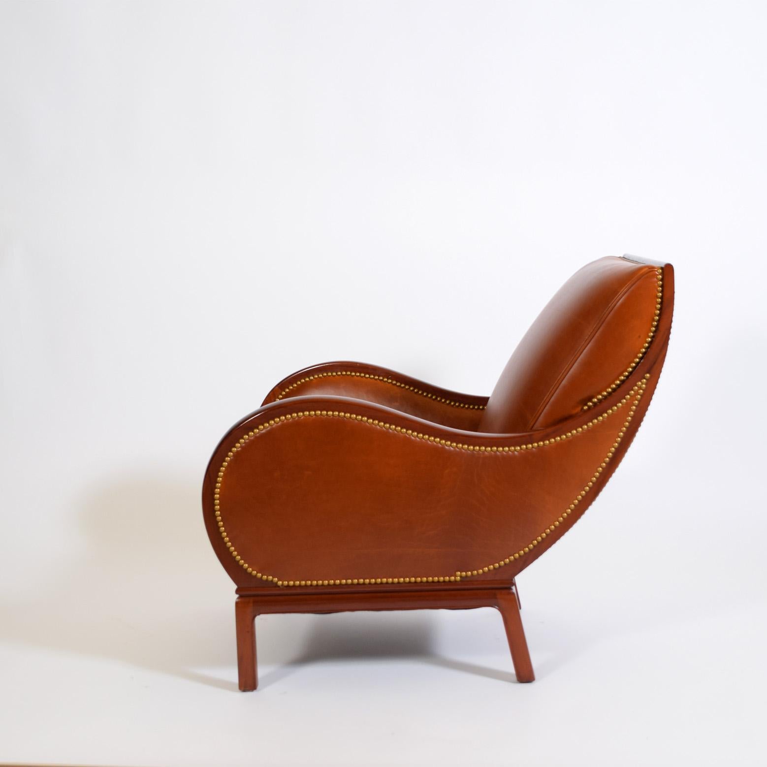 Mid-Century Modern lounge by by Frits Henningsen.  the Bugatti chair For Sale
