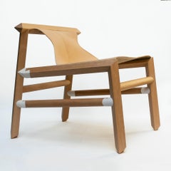 Lounge chair in natural leather and Patagonian wood
