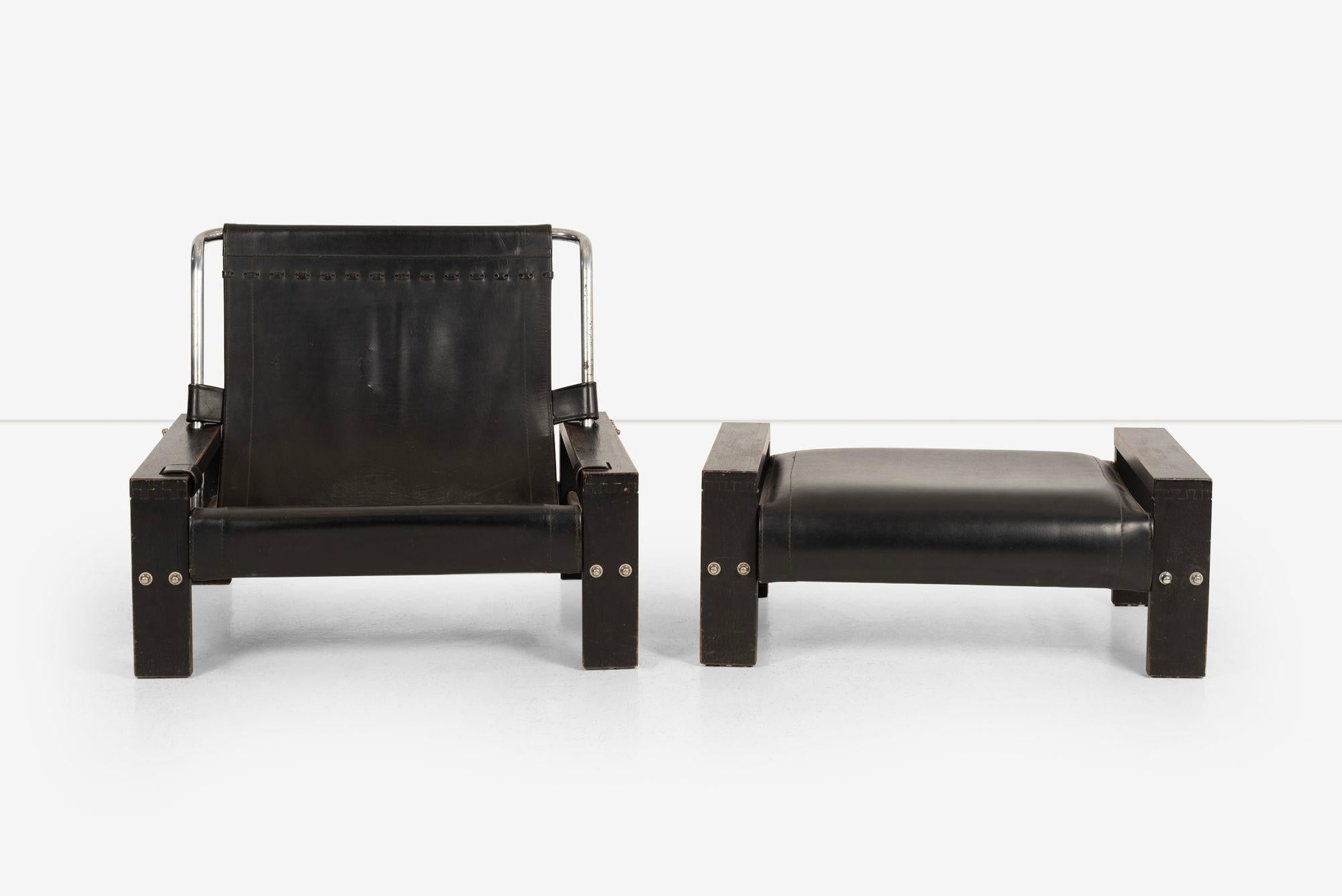 Lounge Chair and Ottoman designed by Atelier Sonja Wasseur, featuring an adjustable buckled back black leather sling lounge chair and a matching cushion ottoman. One of the distinctive features of this set is the rarity of this particular