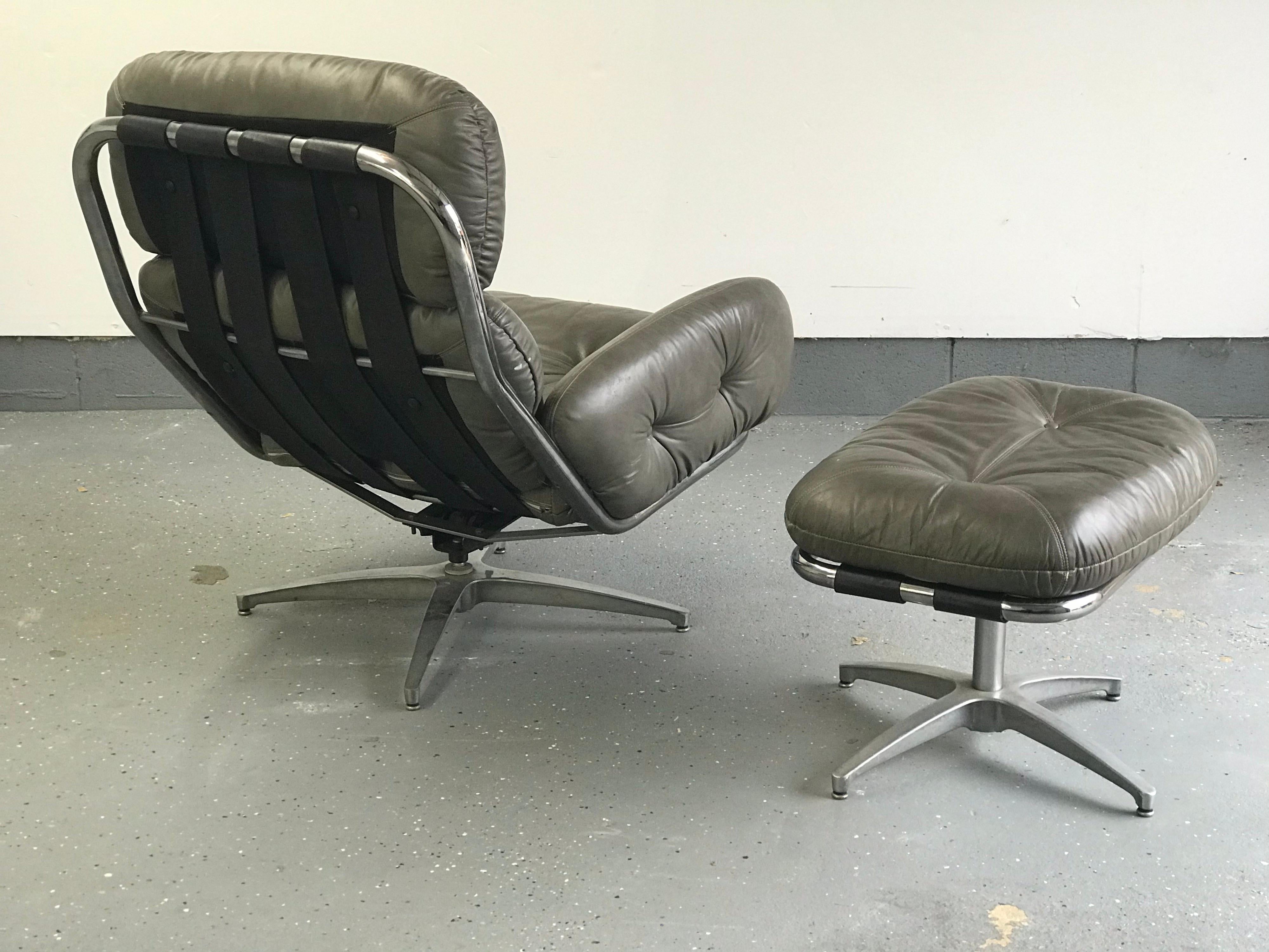 Modernist leather and chrome tubular framed by Directional, 1981, attributed to Milo Baughman. Chair has a swivel and rocking mechanism which works flawlessly. Ottoman also swivels. Leather is in good vintage condition with some light cracking as