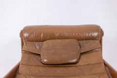 Lounge chair and ottoman in blond elm and leather. 1970s